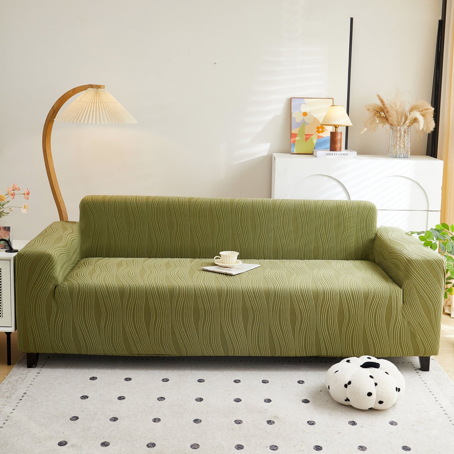 Bright living room showcasing a green Textured Wave Stretch Sofa Couch Cover, Soft Washable Spandex Furniture Slipcovers for a stylish look.