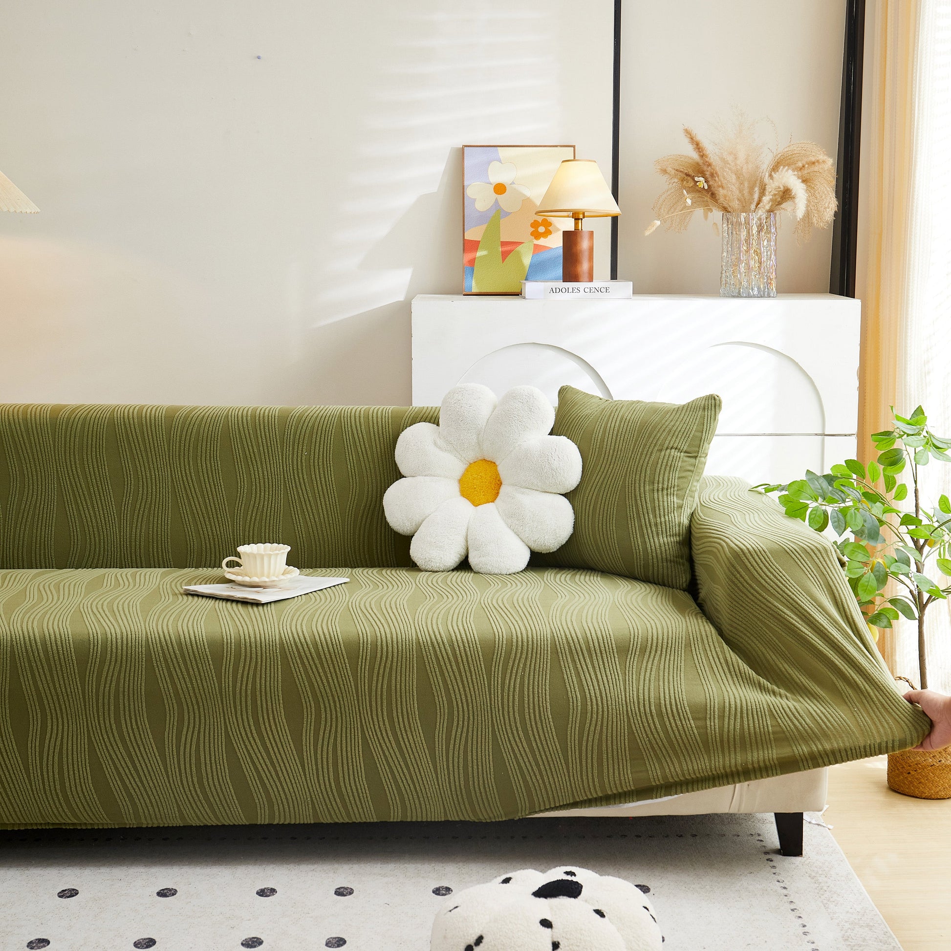 Textured Wave Stretch Sofa Couch Cover, Soft Washable Spandex Furniture Slipcovers on a stylish green couch in a living room.