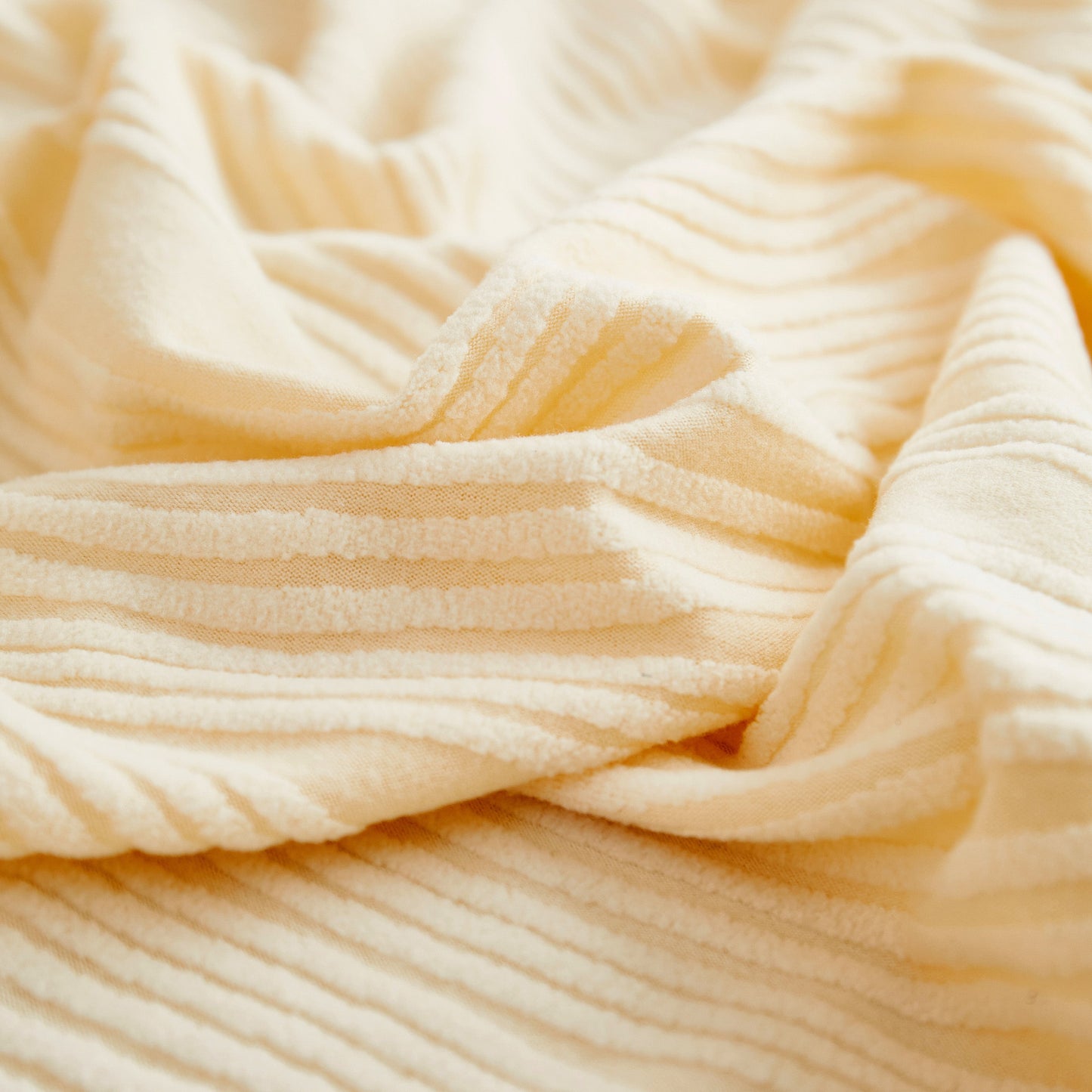 Close-up of the Textured Wave Stretch Sofa Couch Cover, Soft Washable Spandex Furniture Slipcovers showcasing its elegant wave pattern
