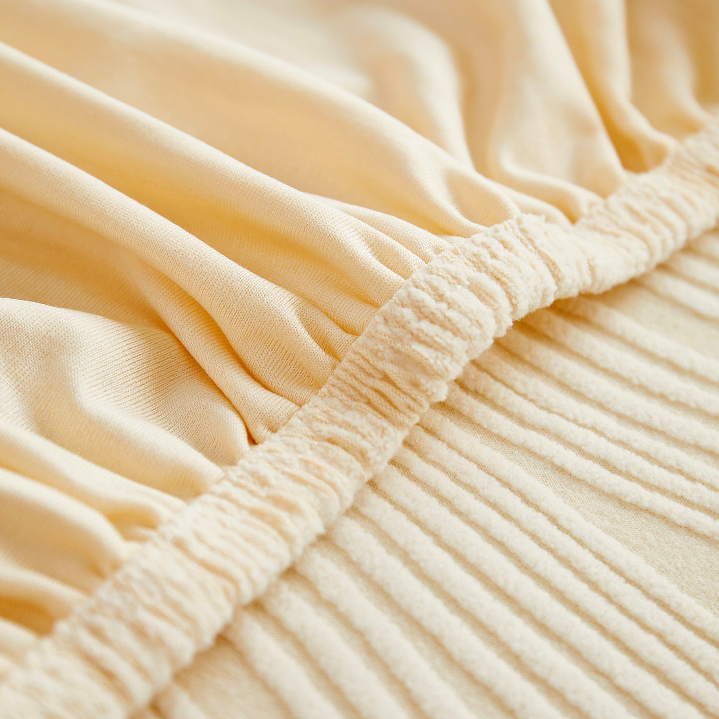 Close-up of Textured Wave Stretch Sofa Couch Cover, Soft Washable Spandex Furniture Slipcovers in cream color