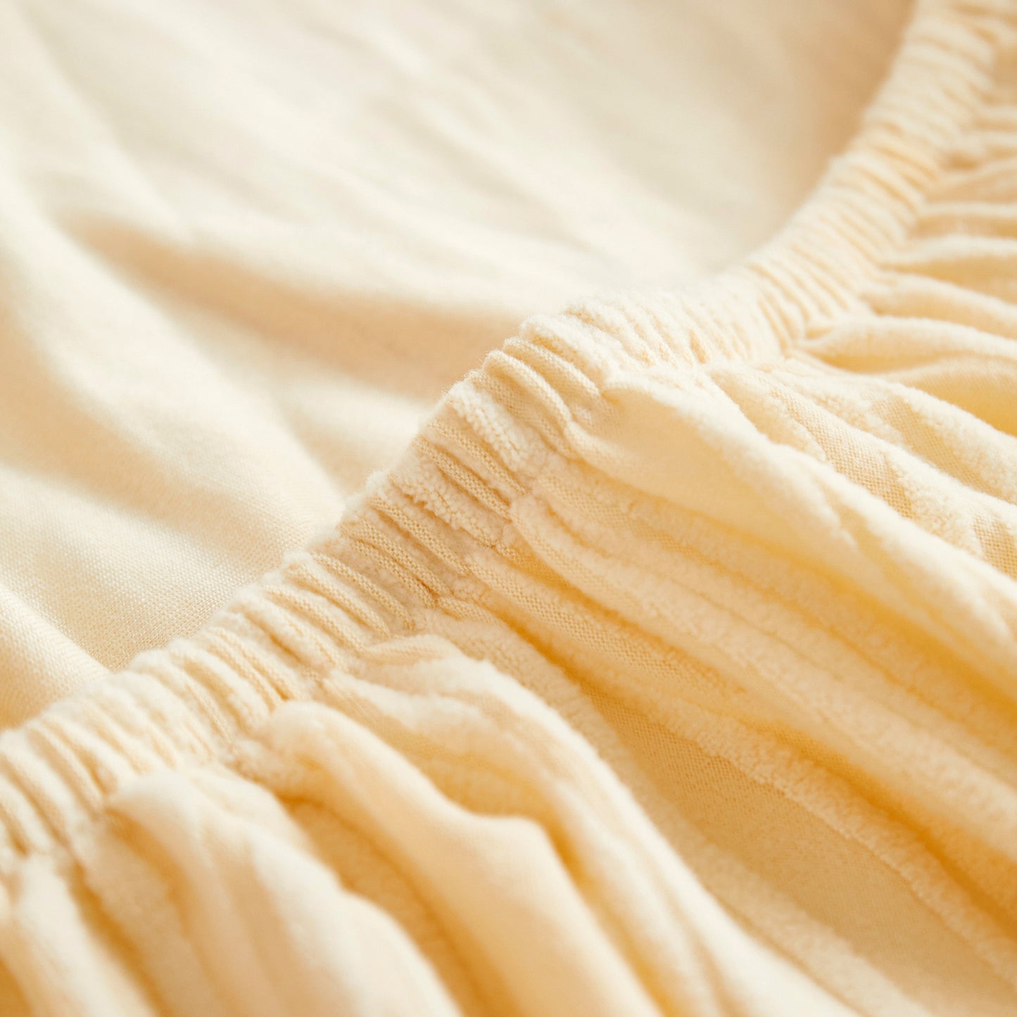 Close-up of the elegant Textured Wave Stretch Sofa Couch Cover, showcasing the soft washable spandex fabric and wave pattern design.