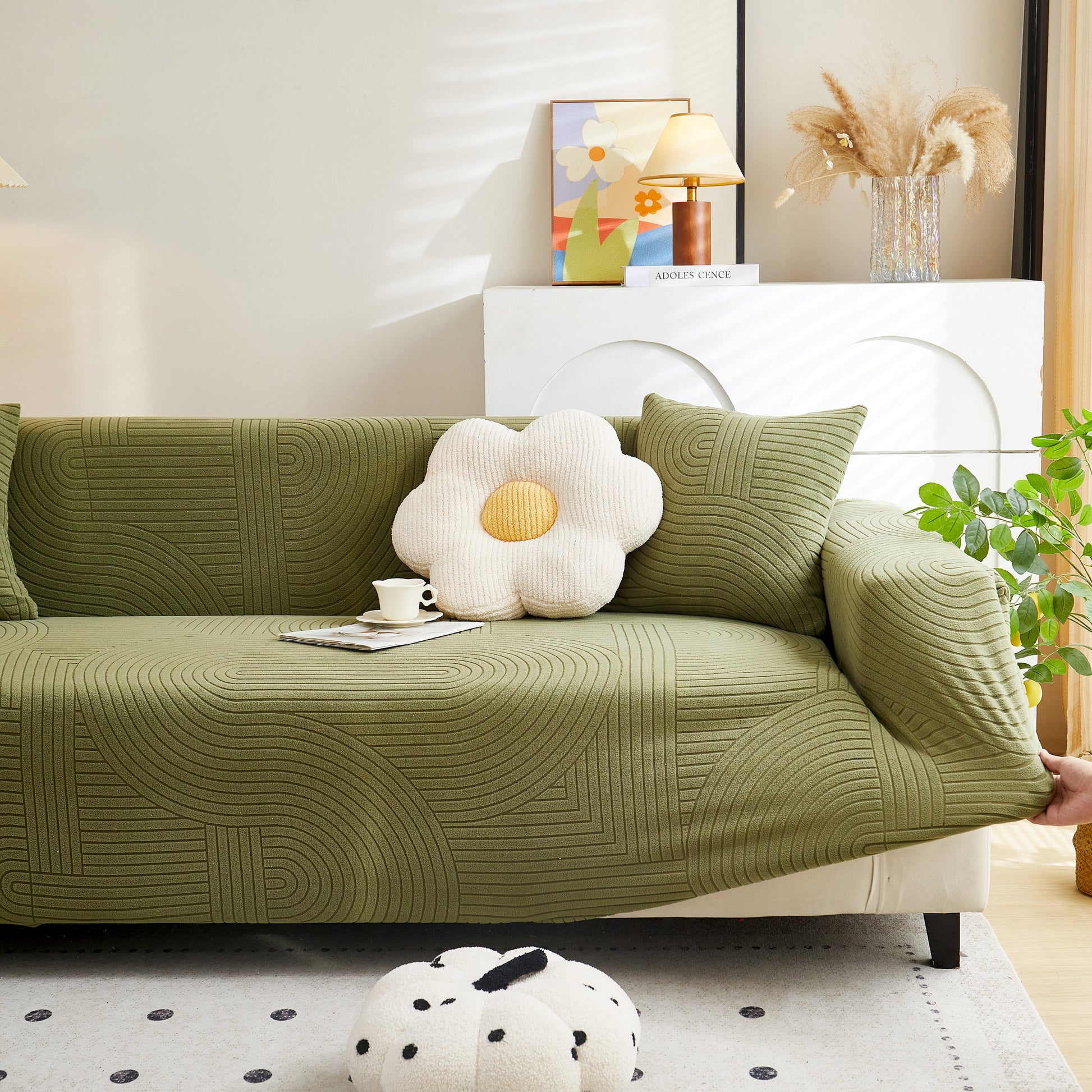 Living room with Fleece Stretch Sofa Slipcover Washable Soft Spandex Couch Cover Furniture Protector in green with geometric pattern.