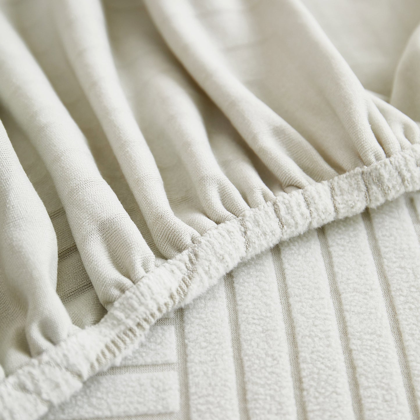 Close-up of Fleece Stretch Sofa Slipcover Washable Soft Spandex Couch Cover Furniture Protector showing elastic fabric and textured finish