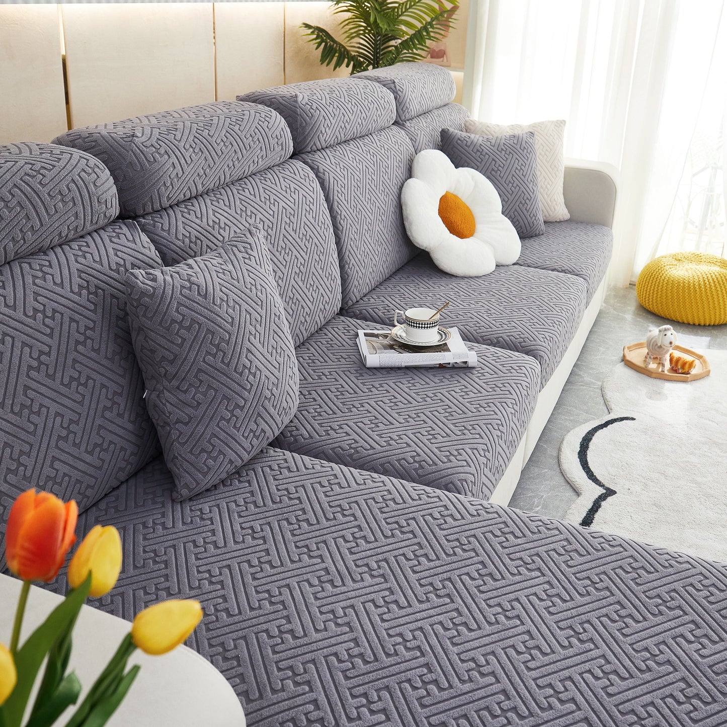 Polar Fleece Couch Cushion Covers on a modern sofa with floral decor, showcasing stretch and elastic protection for pets and kids.