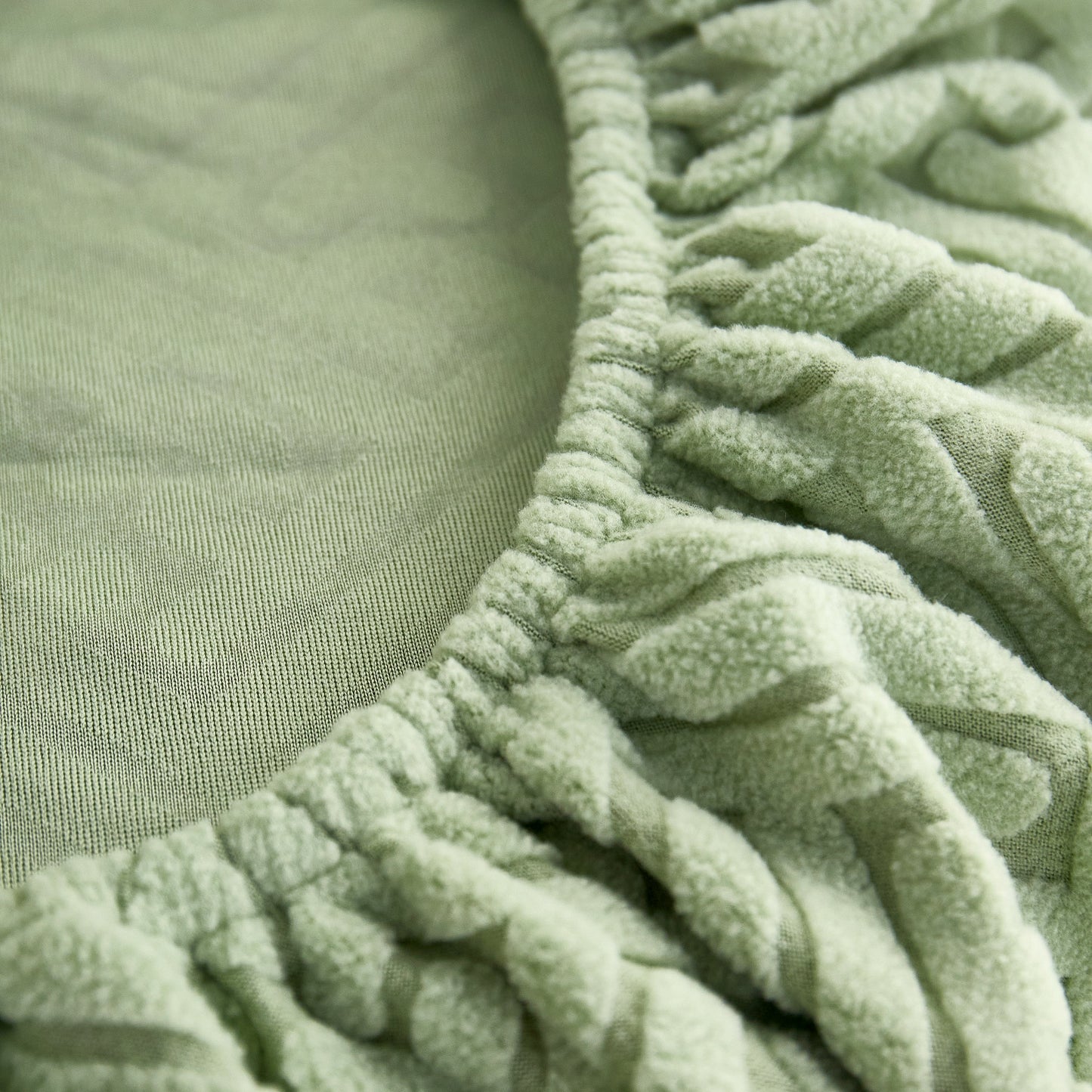 Close-up of Polar Fleece Couch Cushion Covers, Stretch Sofa Seat Cushion Covers, Elastic Furniture Protector for Pets, Kid in green.