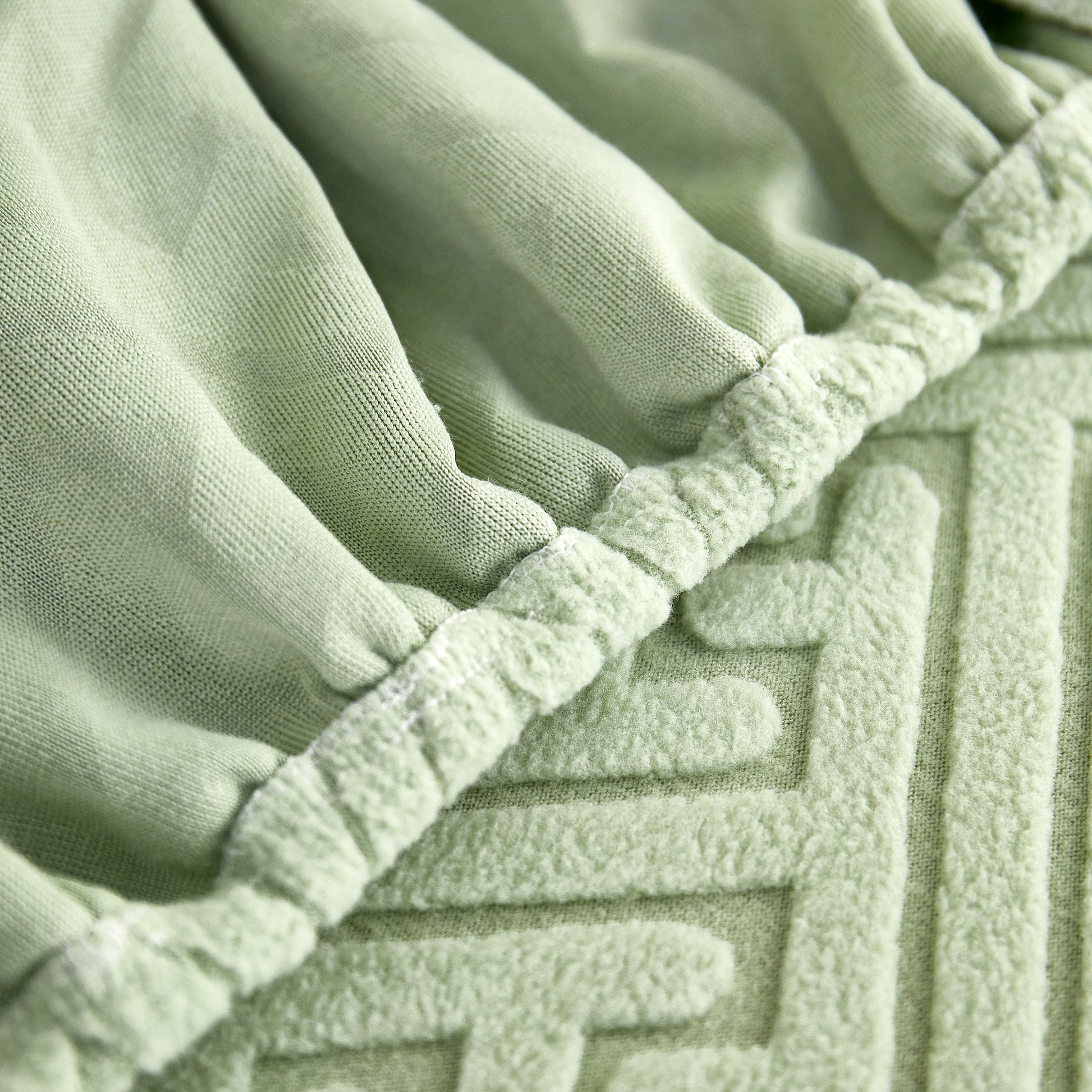 Close-up of Polar Fleece Couch Cushion Covers, Stretch Sofa Seat Cushion Covers, Elastic Furniture Protector for Pets, Kid in green color