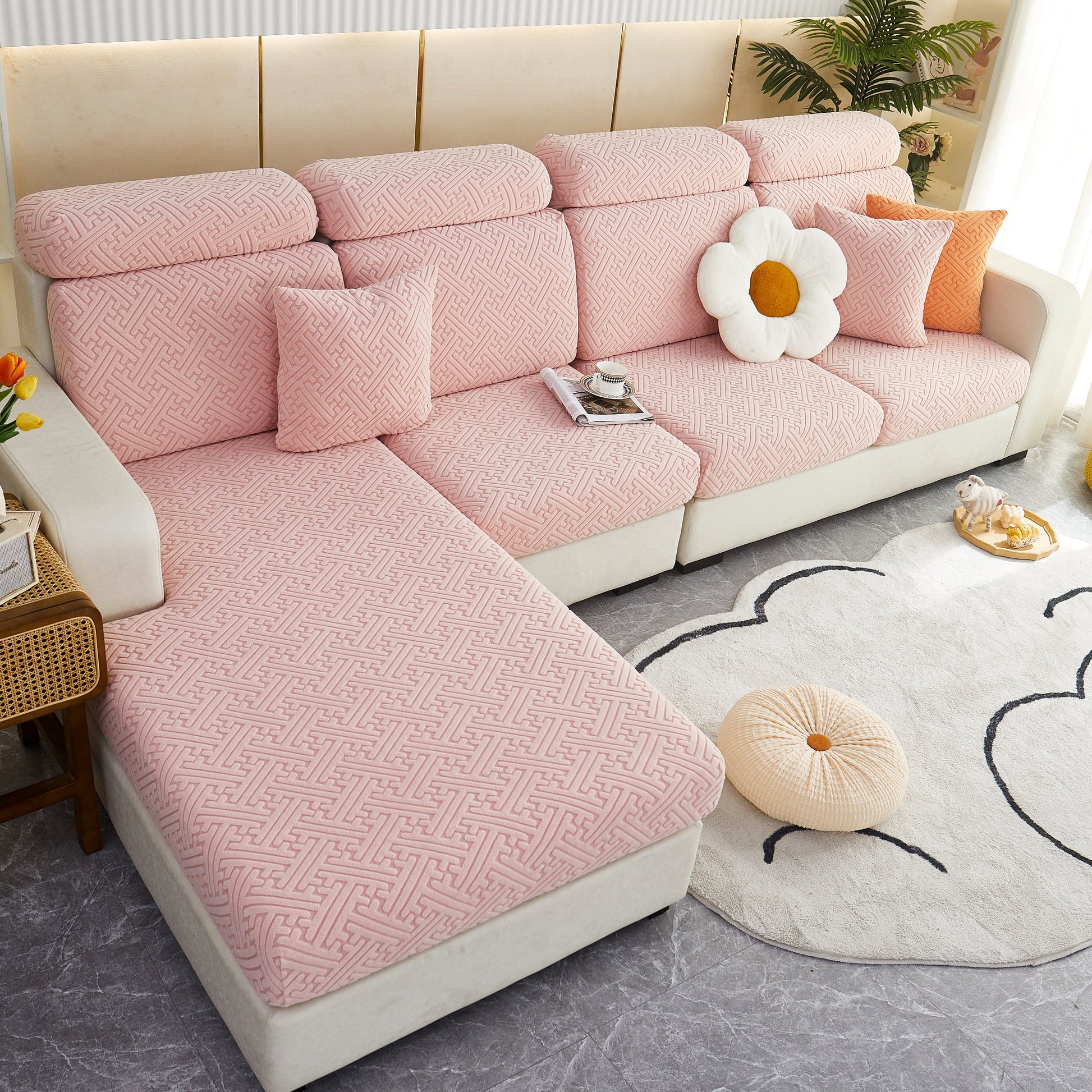 Soft pink stretch sofa seat cushion covers on a modern couch, showcasing Polar Fleece Couch Cushion Covers for pet and kid protection.