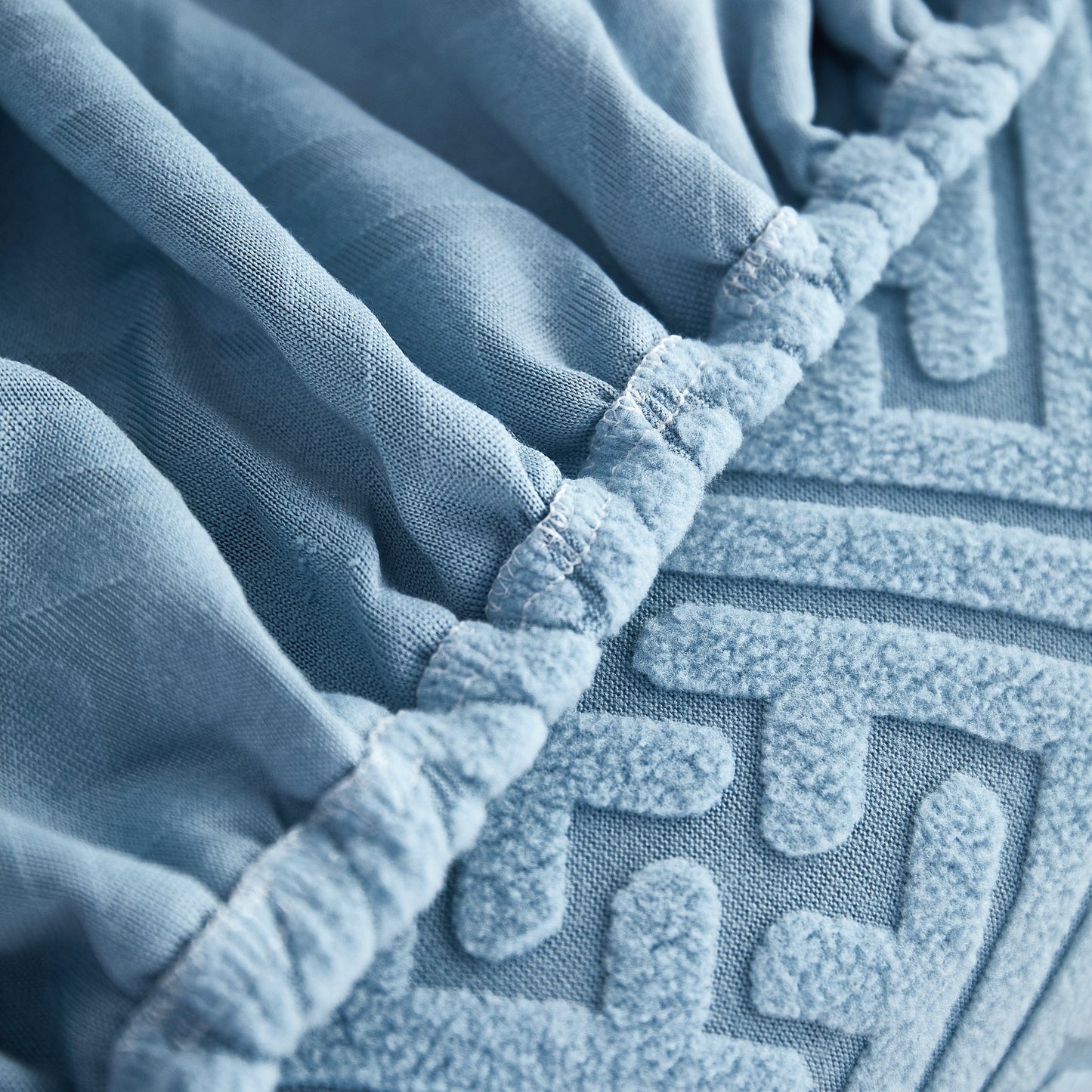 Close-up of blue Polar Fleece Couch Cushion Covers, Stretch Sofa Seat Cushion Covers, Elastic Furniture Protector for Pets, Kid.