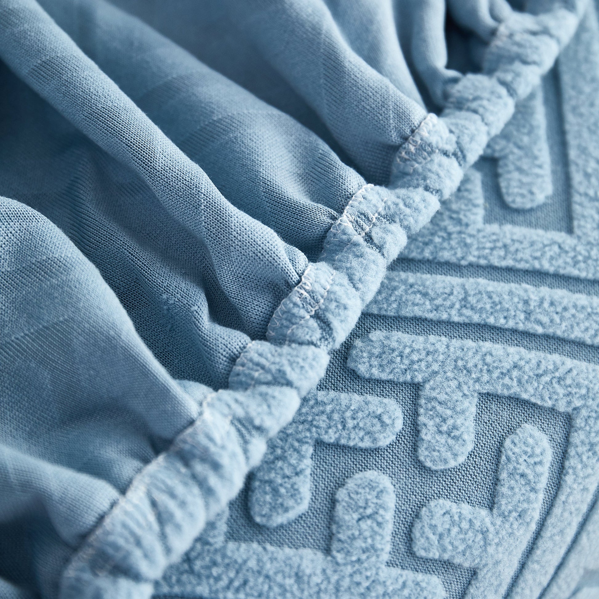 Close-up of blue Polar Fleece Couch Cushion Covers, Stretch Sofa Seat Cushion Covers, Elastic Furniture Protector for Pets, Kid.