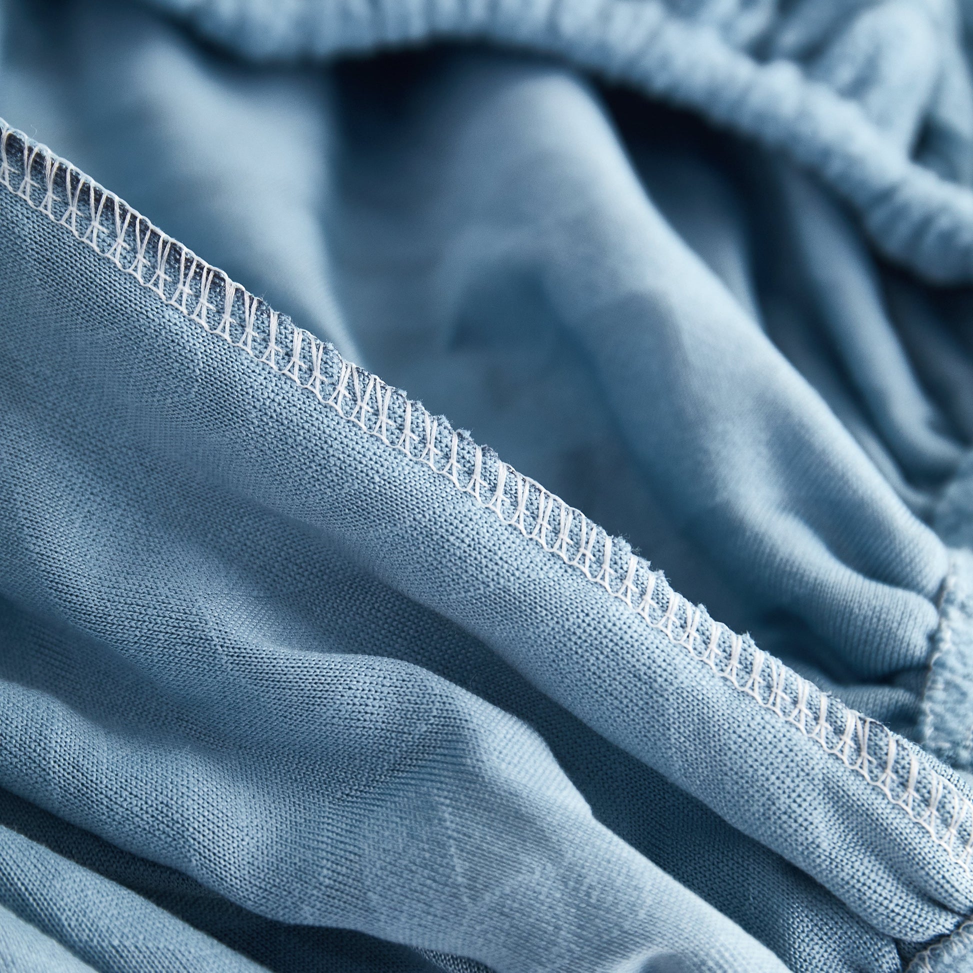 Close-up of Polar Fleece Couch Cushion Covers showcasing stretch and elastic fit for furniture protection.