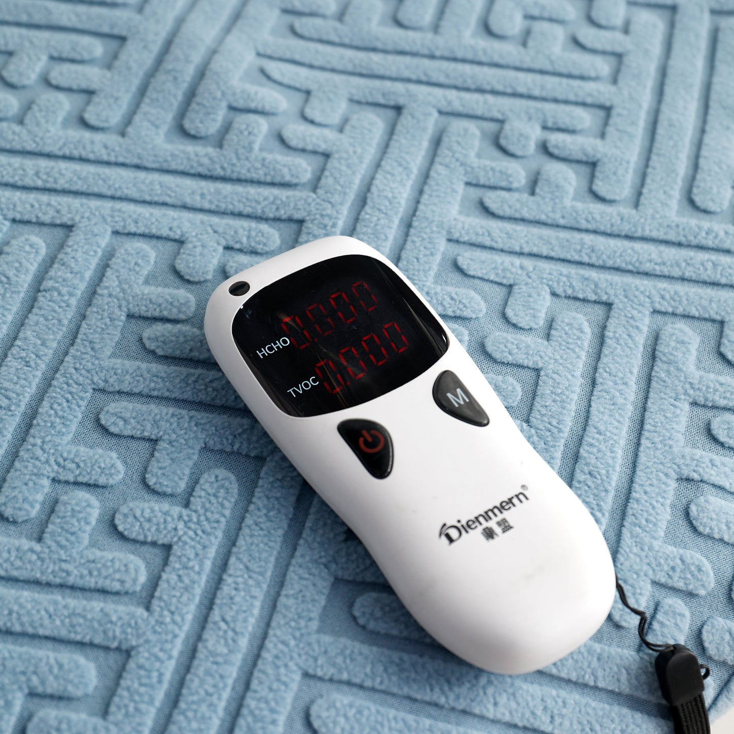 Electronic device on a patterned blue fabric surface
