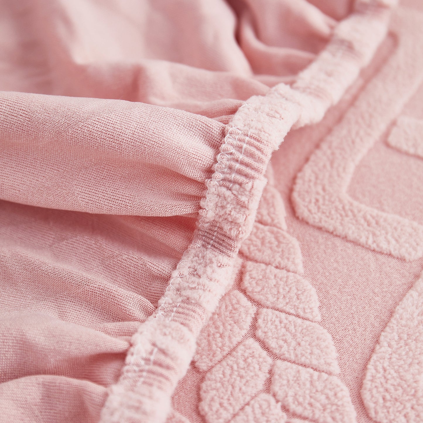 Close-up of pink Stretch Couch Seat Cushion Covers, Sofa Slipcover Sofa Cover Soft Flexibility with Elastic Bottom material.