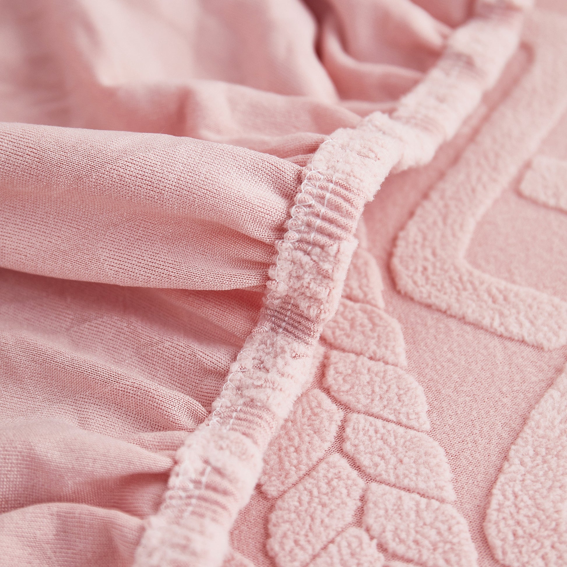 Close-up of pink Stretch Couch Seat Cushion Covers, Sofa Slipcover Sofa Cover Soft Flexibility with Elastic Bottom material.