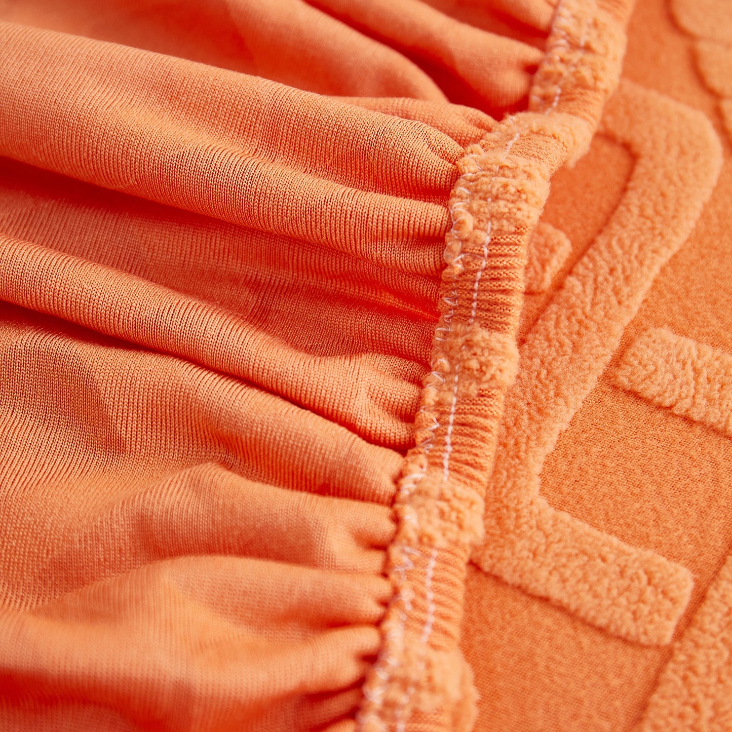Close-up of orange Stretch Couch Seat Cushion Covers, Sofa Slipcover Sofa Cover Soft Flexibility with Elastic Bottom fabric and texture