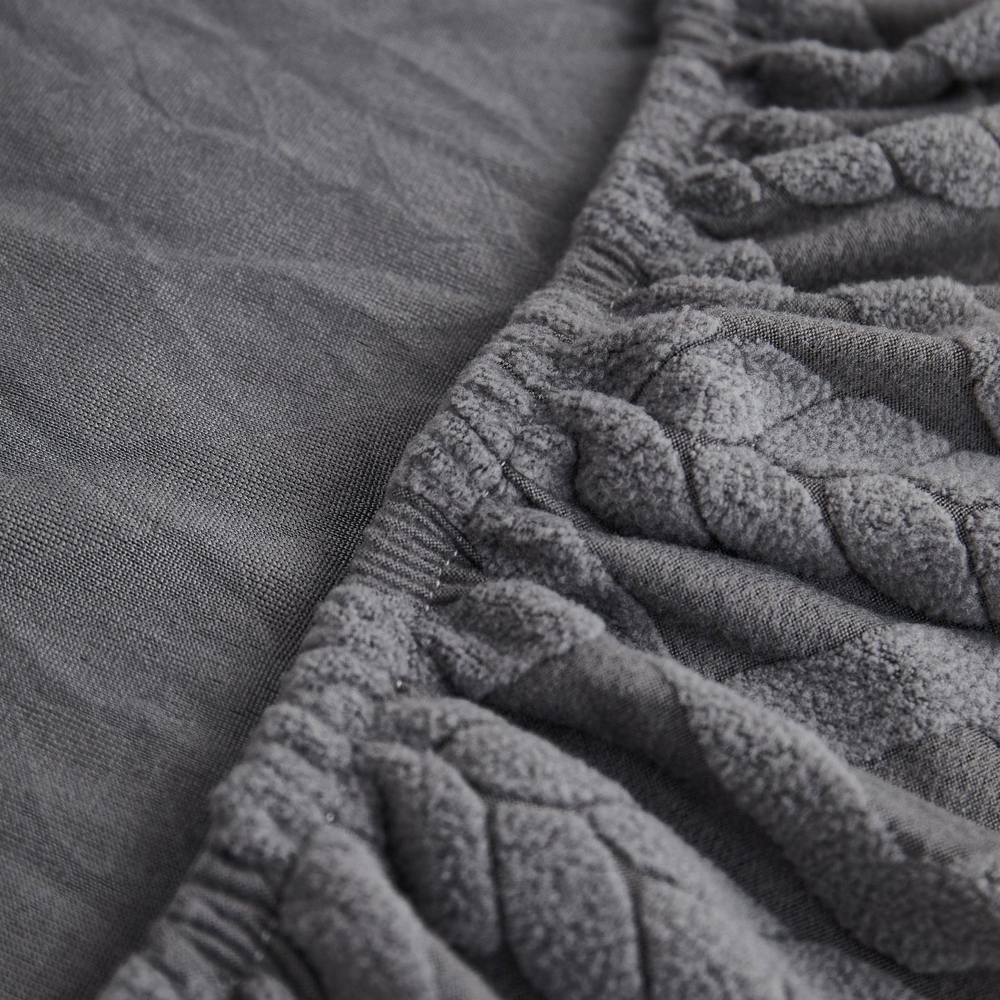 Close-up of Stretch Couch Seat Cushion Covers, Sofa Slipcover with Soft Elastic Bottom in grey fabric