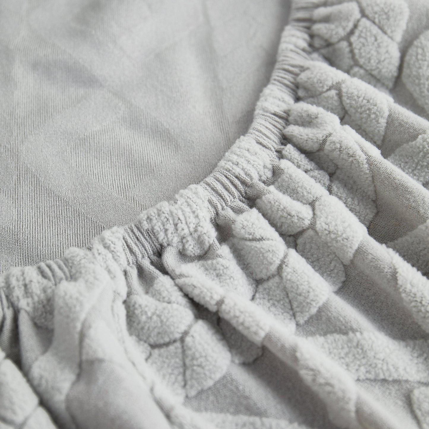 Close-up of Stretch Couch Seat Cushion Covers, Sofa Slipcover Sofa Cover Soft Flexibility with Elastic Bottom in light grey fabric.