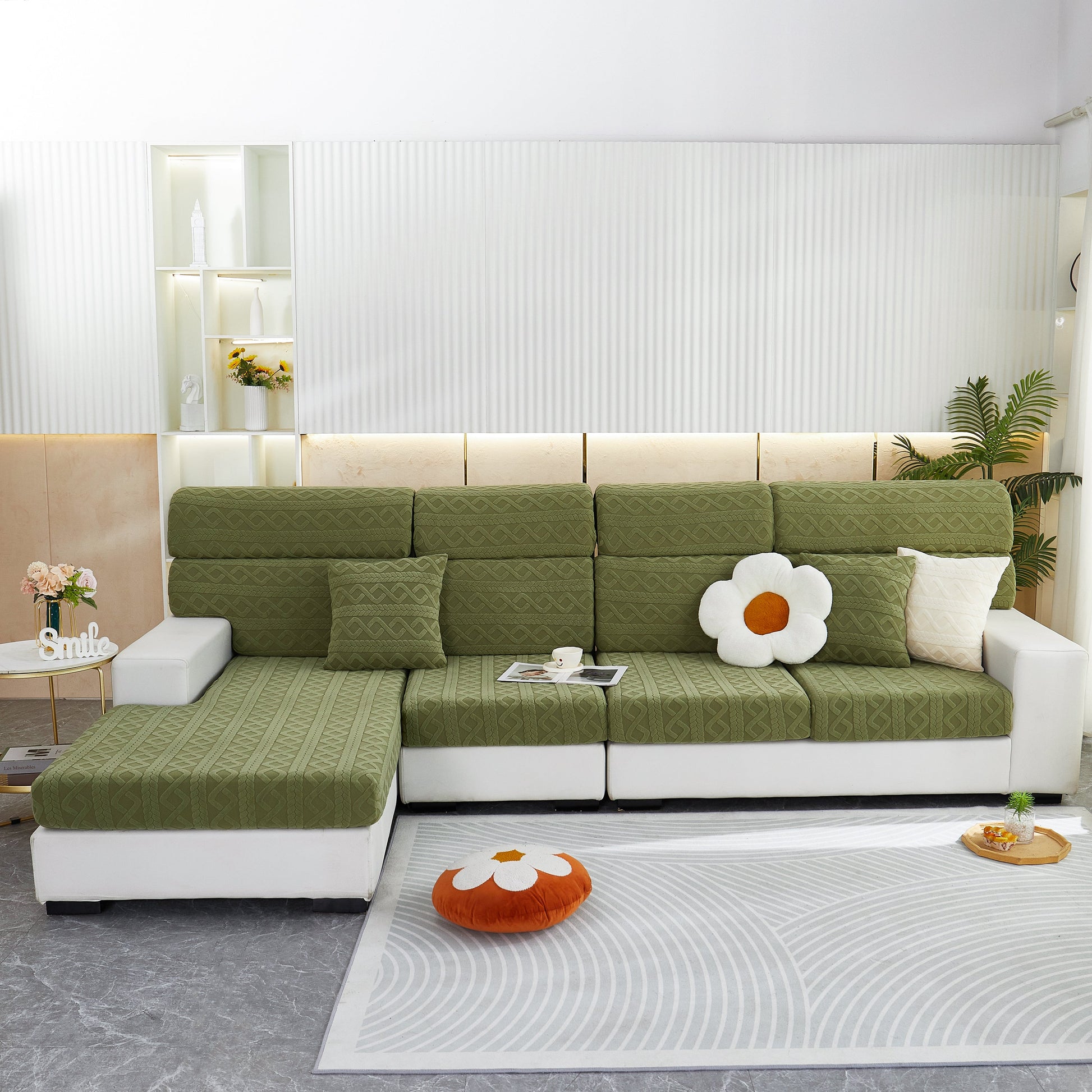 Green stretch couch seat cushion covers on modern sofa, showcasing sofa slipcover with soft flexibility and elastic bottom for protection.