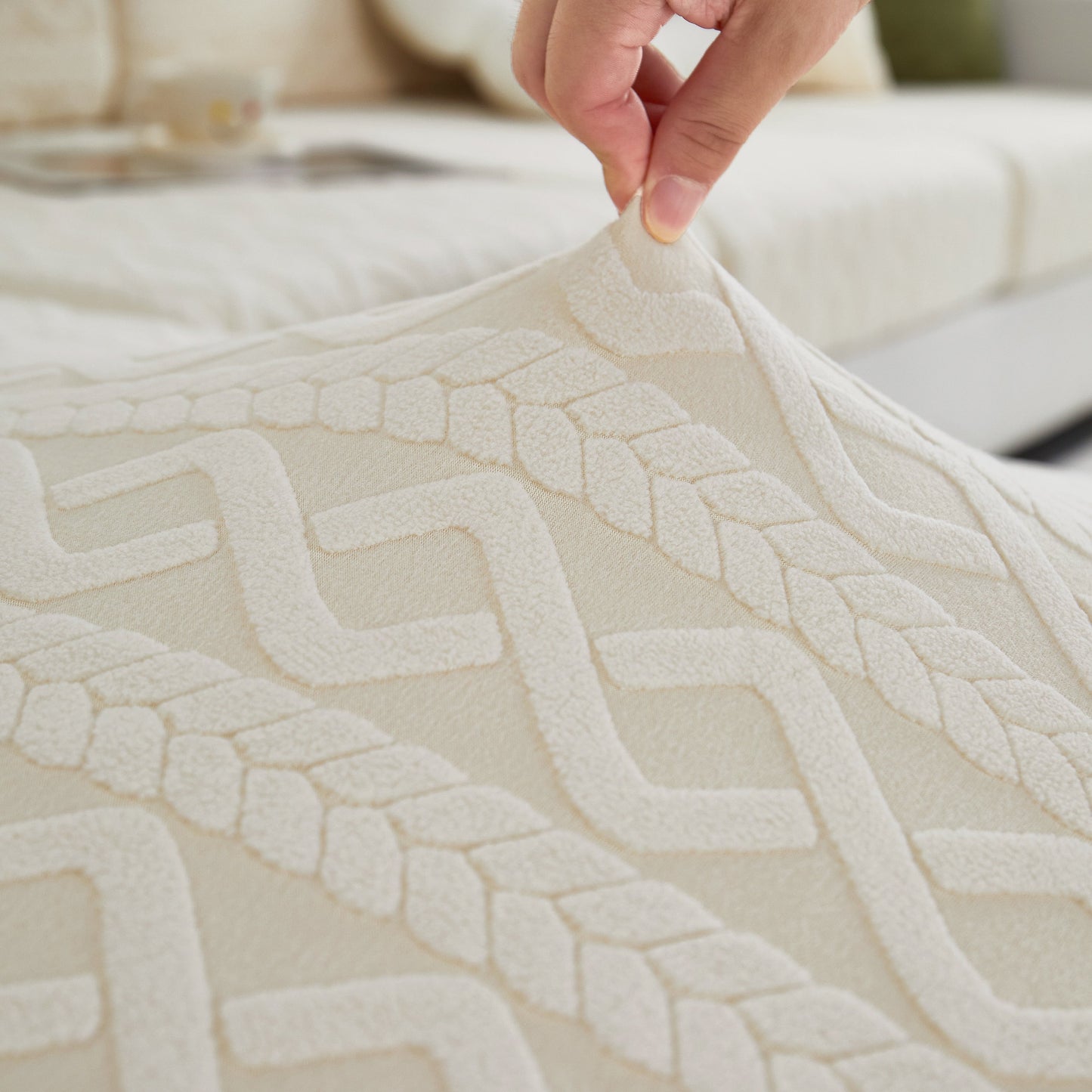 Close-up of hand adjusting Stretch Couch Seat Cushion Covers, Sofa Slipcover Sofa Cover Soft Flexibility with Elastic Bottom.