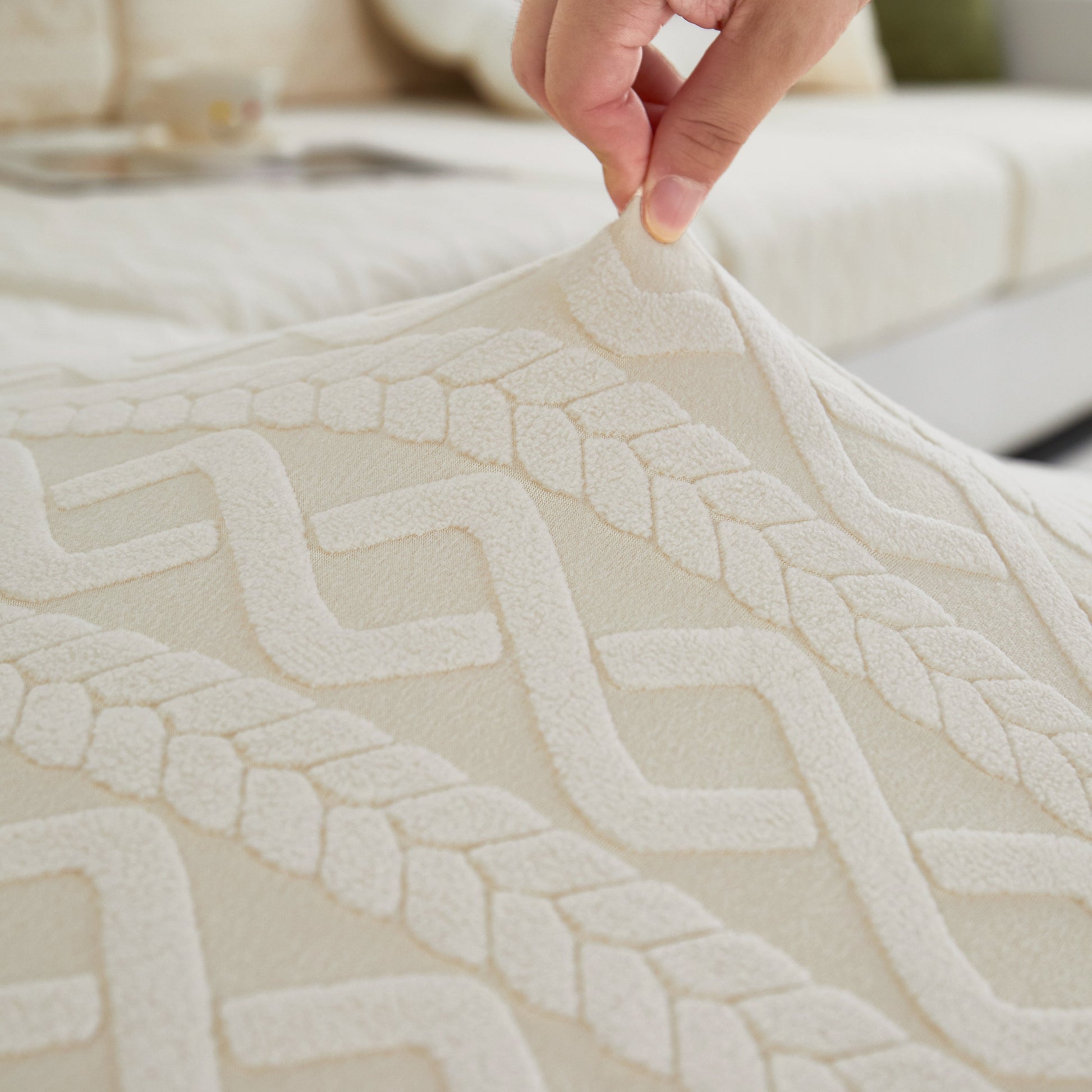 Close-up of hand adjusting Stretch Couch Seat Cushion Covers, Sofa Slipcover Sofa Cover Soft Flexibility with Elastic Bottom.