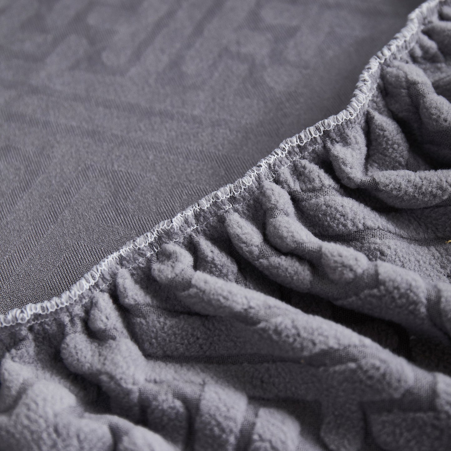 Close-up of Stretch Sofa Covers with Skirt for Couch Seat and Cushion, Chaise, Sectional, 1/2/3/4 Seater Sofas fabric texture.