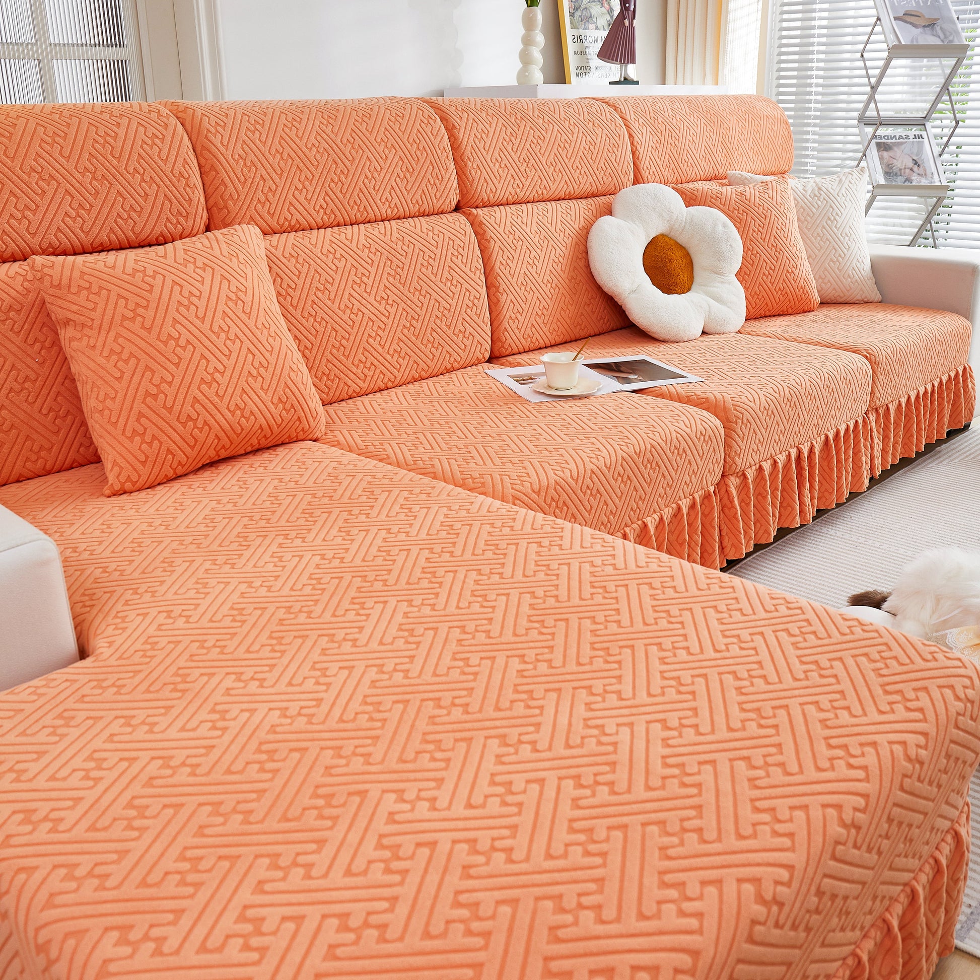 Stretch Sofa Covers with Skirt for Couch Seat and Cushion, Chaise, Sectional, 1/2/3/4 Seater Sofas in a bright orange color.