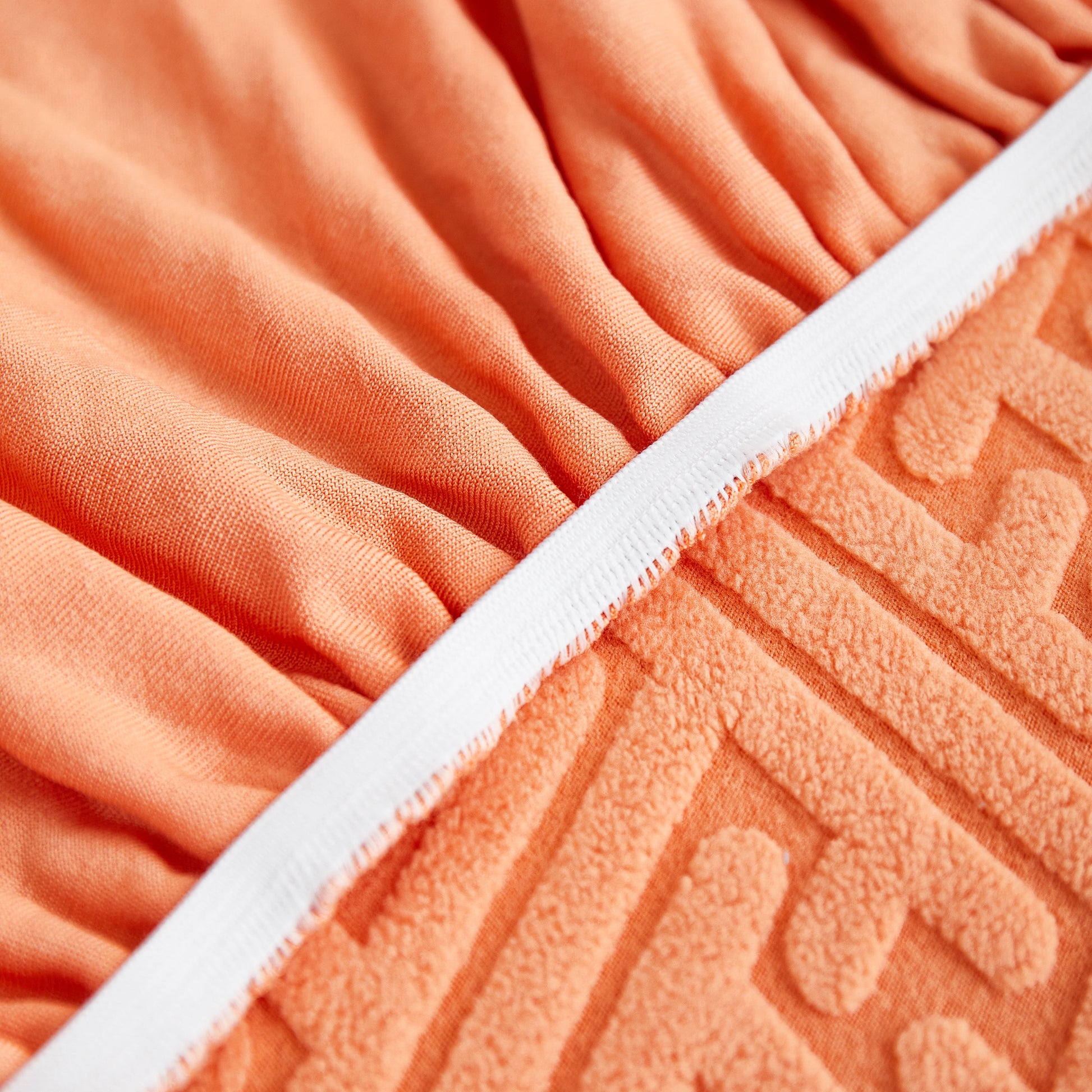 Close-up of stretch fabric with skirt detail for Stretch Sofa Covers with Skirt for Couch Seat and Cushion, Chaise, Sectional, 1/2/3/4 Seater Sofas.