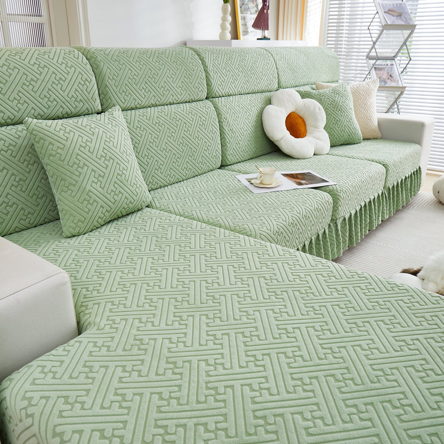 Stretch Sofa Covers with Skirt for Couch Seat and Cushion, Chaise, Sectional, displayed on a green patterned sofa in a living room