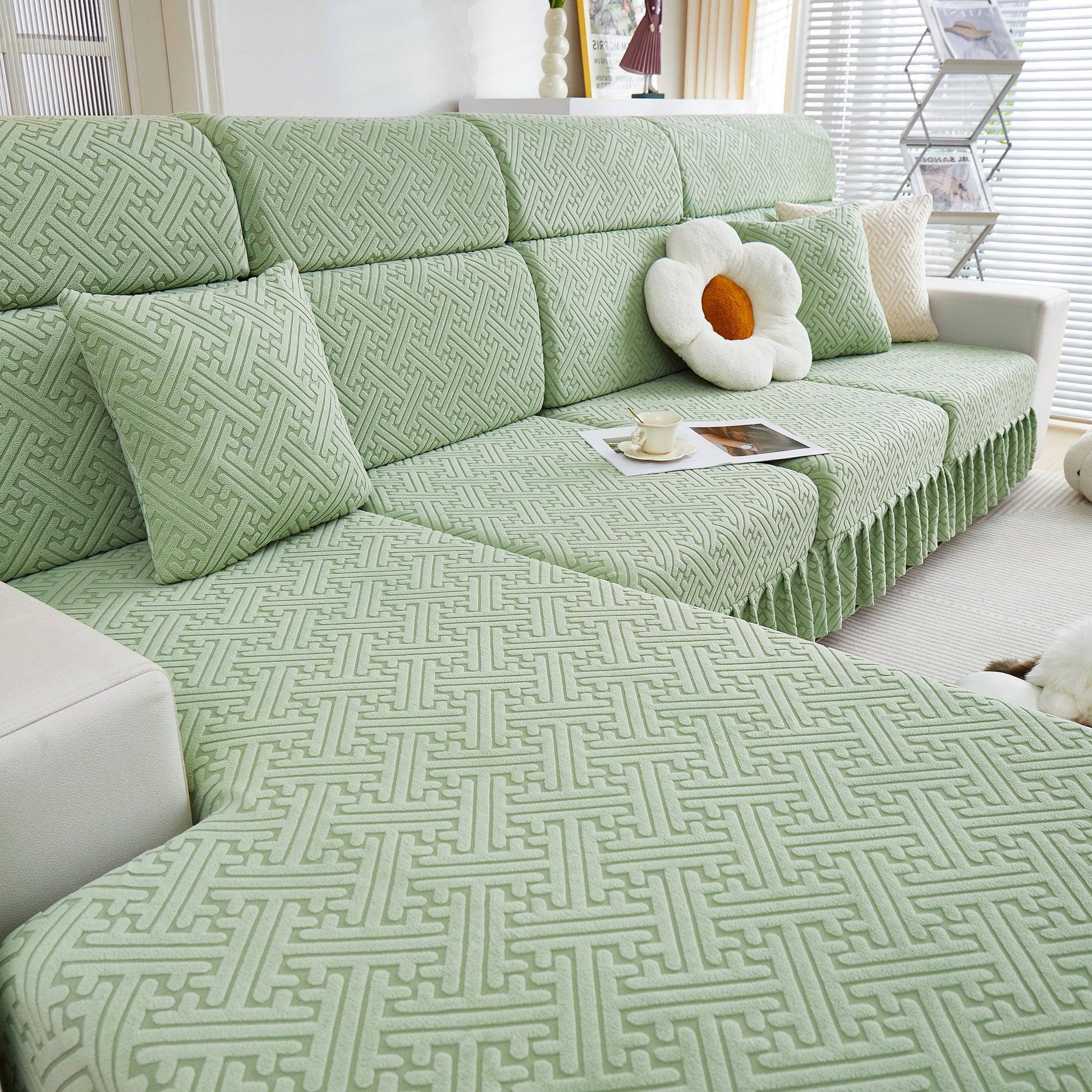 Stretch Sofa Covers with Skirt for Couch Seat and Cushion, Chaise, Sectional, displayed on a green patterned sofa in a living room