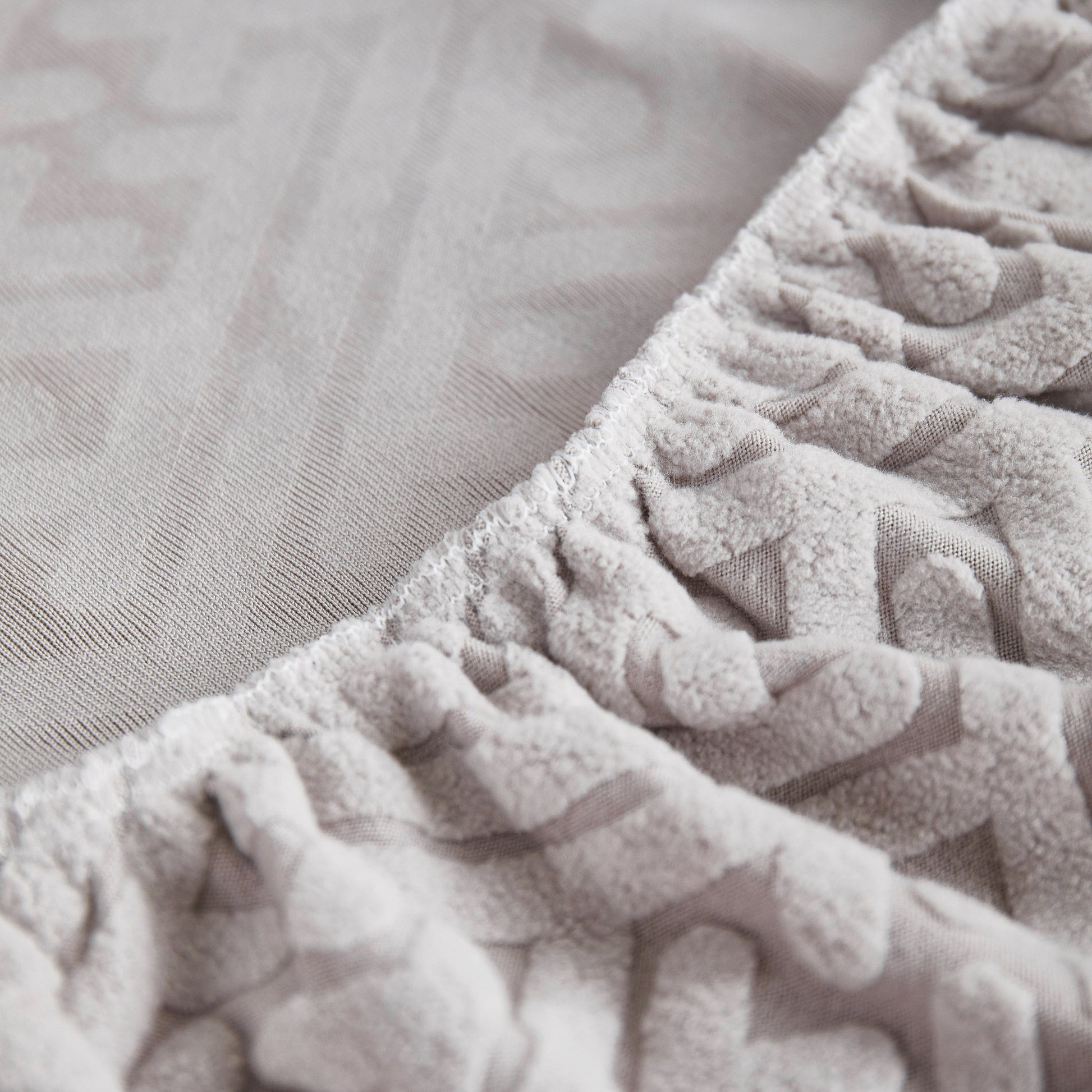 Close-up view of high-quality fabric of Stretch Sofa Covers with Skirt for Couch Seat and Cushion, Chaise, Sectional, 1/2/3/4 Seater Sofas.