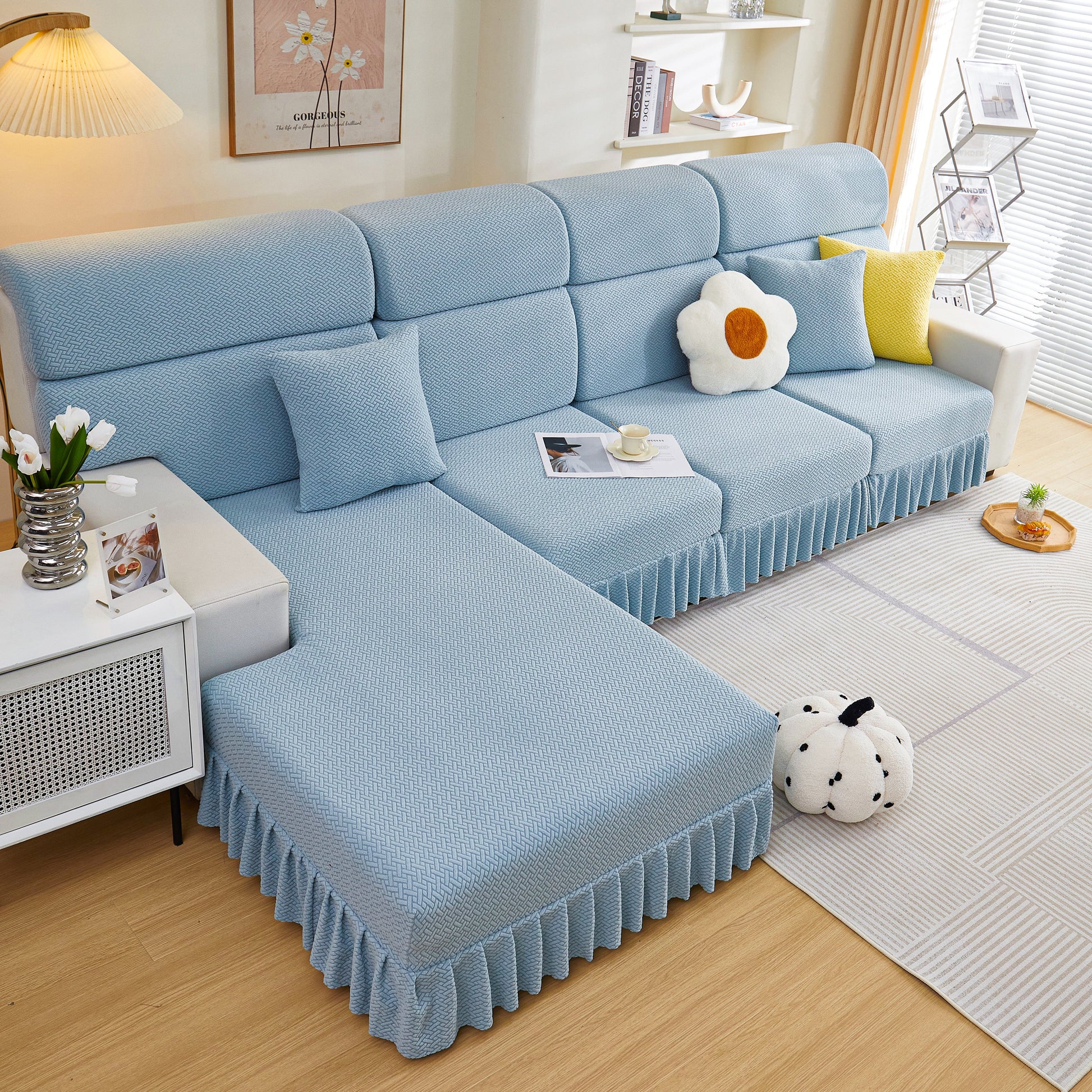 Tailored Sofa Cushion Covers Stretch Couch Seat Covers with Skirt for Sectional Sofas in light blue displayed in modern living room