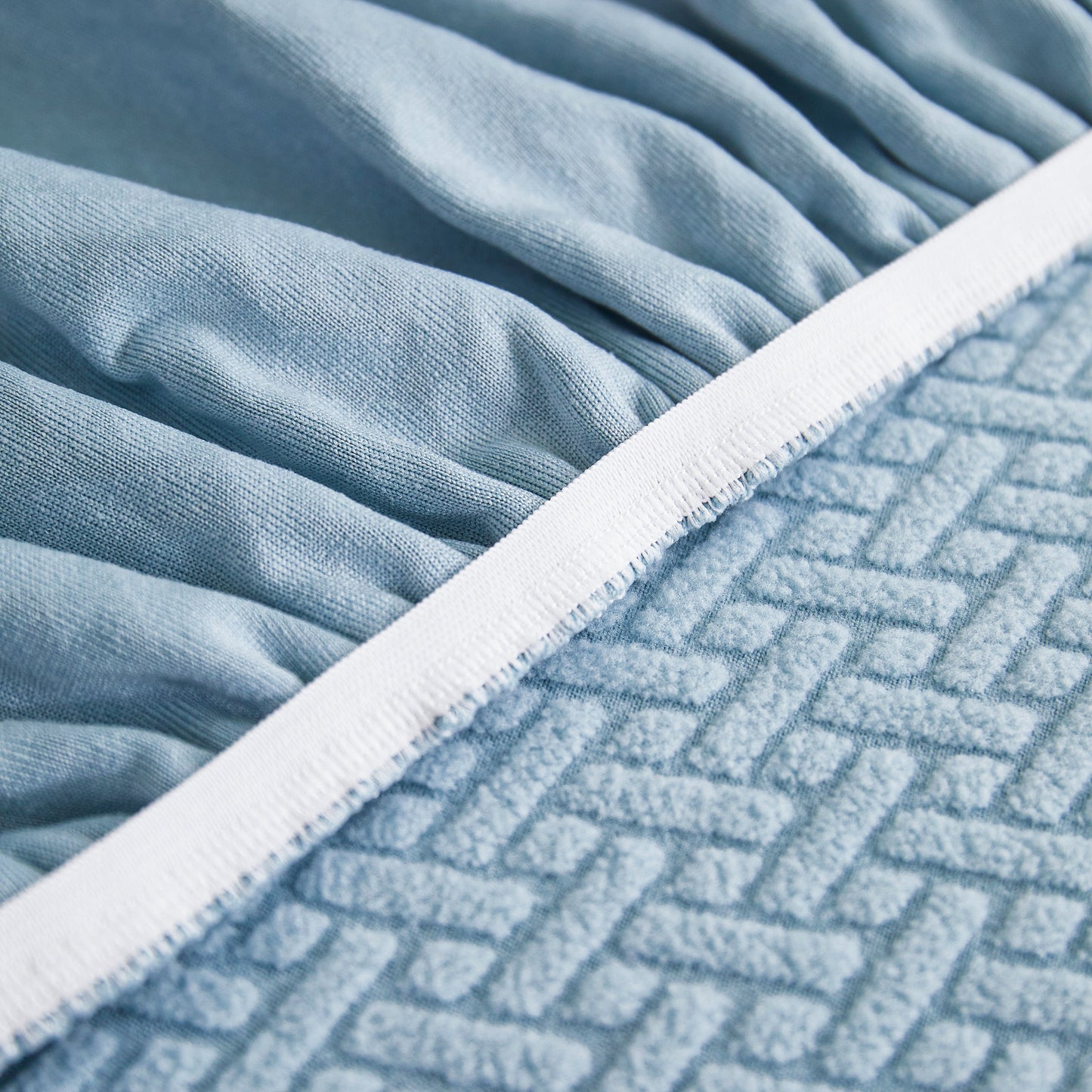 Close-up of blue Tailored Sofa Cushion Covers Stretch Couch Seat Covers with Skirt for Sectional Sofas showing fabric texture and details.