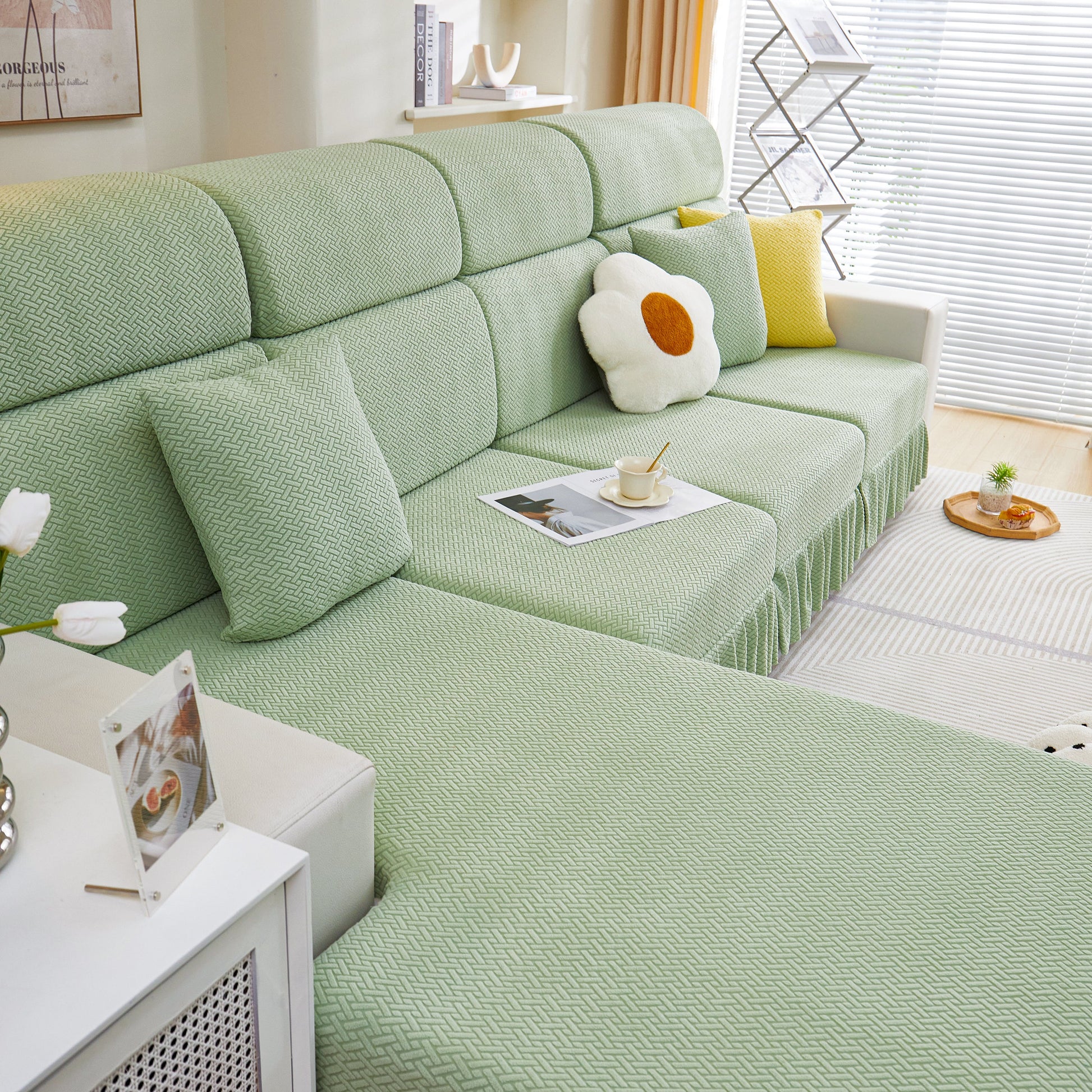 Tailored Sofa Cushion Covers Stretch Couch Seat Covers with Skirt for Sectional Sofas in green in a modern living room
