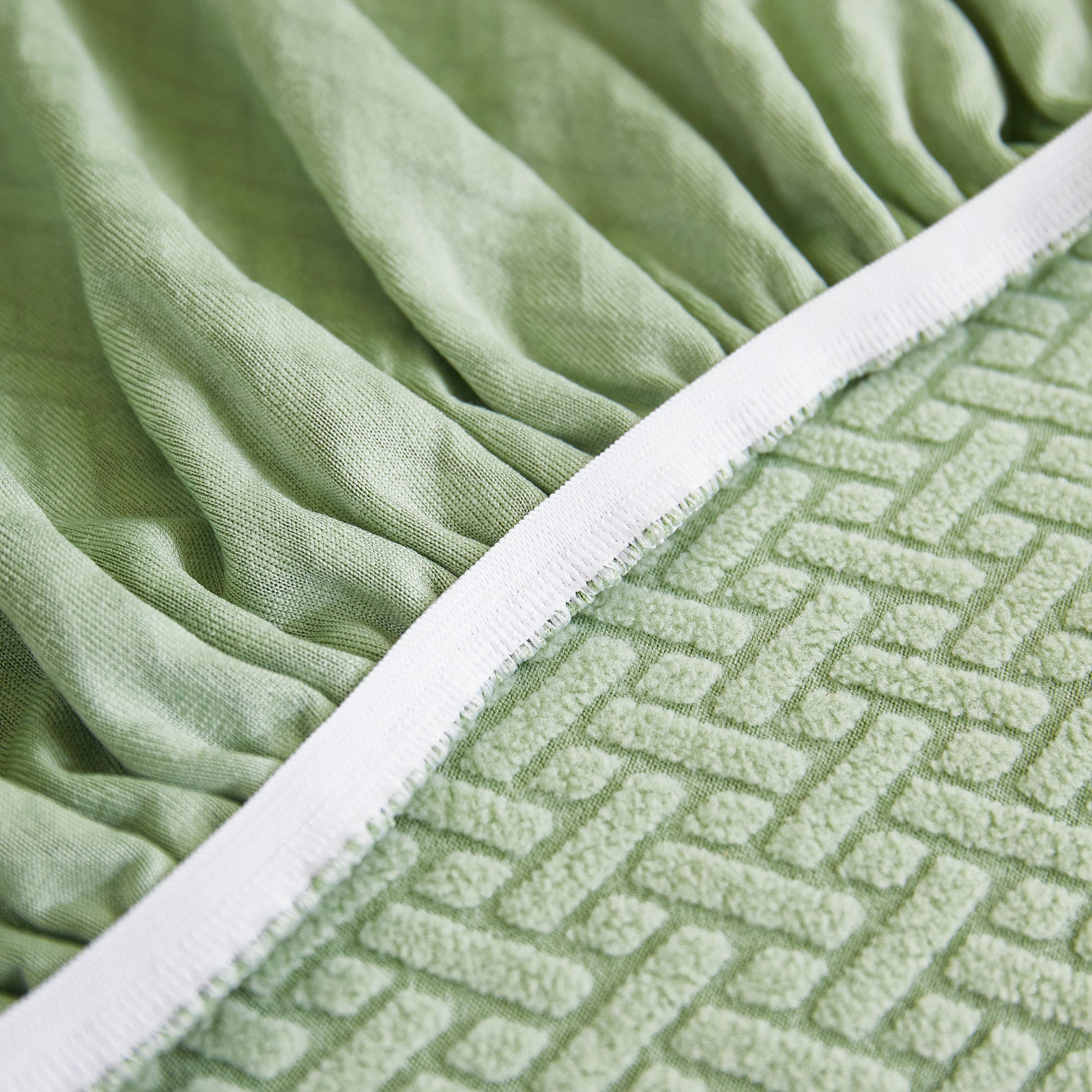 Close-up of Tailored Sofa Cushion Covers Stretch Couch Seat Covers with Skirt for Sectional Sofas in green fabric