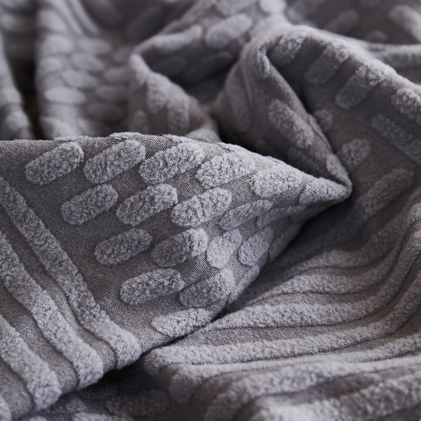 Close-up of gray fabric pattern on Stretch Sofa Covers for Couch Seats and Cushions, Suitable for 1/2/3/4/L Seater Sofas and Couches