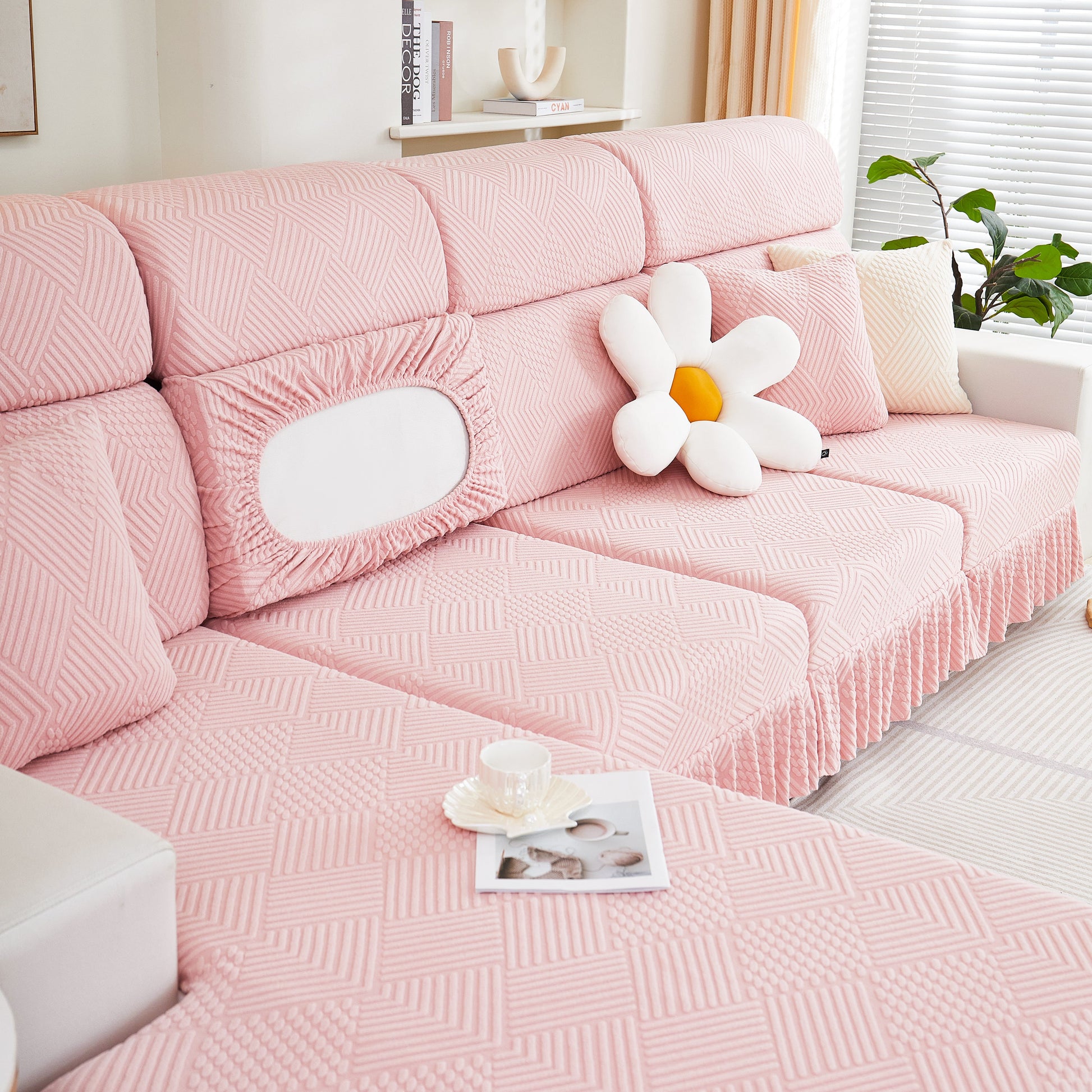 Stretch Sofa Covers for Couch Seats and Cushions, Suitable for 1/2/3/4/L Seater Sofas and Couches in pink with decorative pillow.