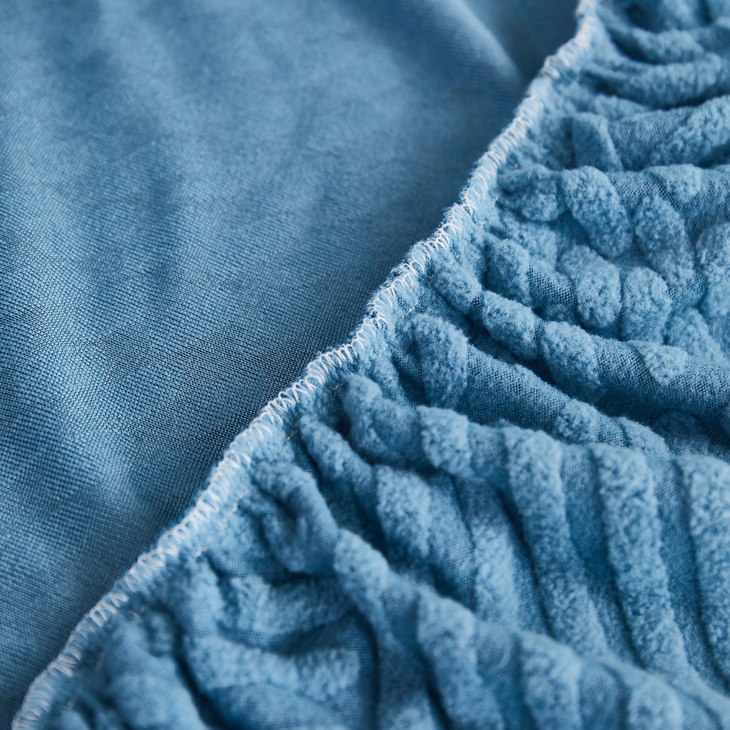Close-up of blue Stretch Sofa Covers for Couch Seats and Cushions, Suitable for 1/2/3/4/L Seater Sofas and Couches with stylish texture.