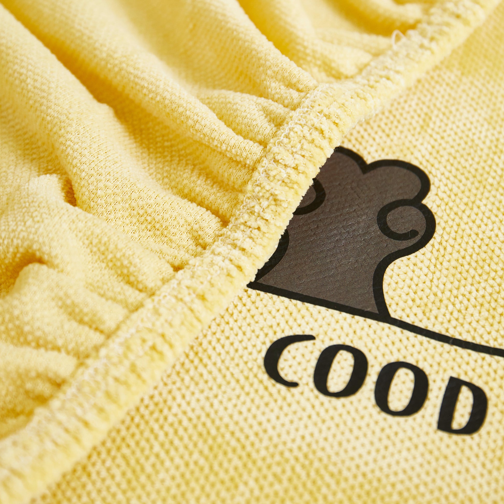 Close-up of Super Stretch Seat Cushion/Couch Slipcover, Solid Couch Cushion Covers Washable Furniture Protector in yellow fabric.