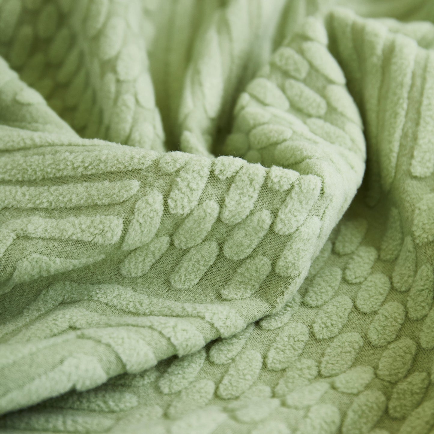 Close-up of green fabric texture for Stretch Sofa Covers for Couch Seats and Cushions, Suitable for 1/2/3/4/L Seater Sofas and Couches.