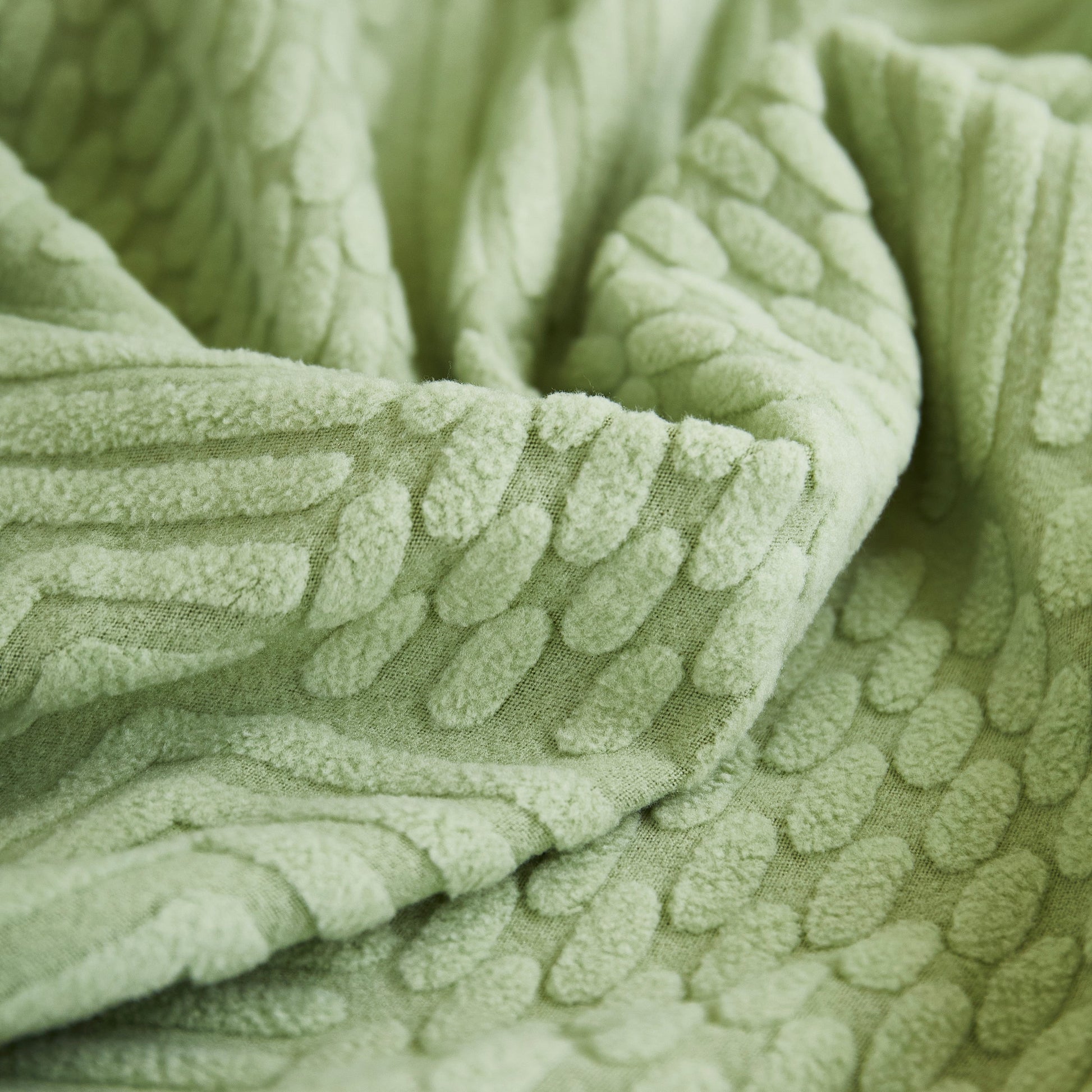 Close-up of green fabric texture for Stretch Sofa Covers for Couch Seats and Cushions, Suitable for 1/2/3/4/L Seater Sofas and Couches.