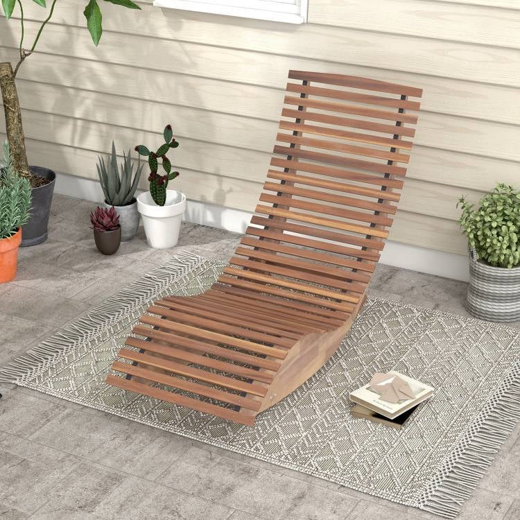 Outdoor Ergonomic Patio Wooden Rocking Chair Lounger - 360 lbs Max Weight on a patio rug beside potted plants, wooden slats design