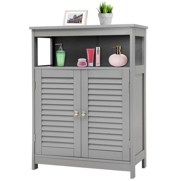 Grey Farmhouse Bathroom Linen Cabinet with Louvered Doors and Open Shelf in a bathroom setting, showcasing accessories on the shelf.