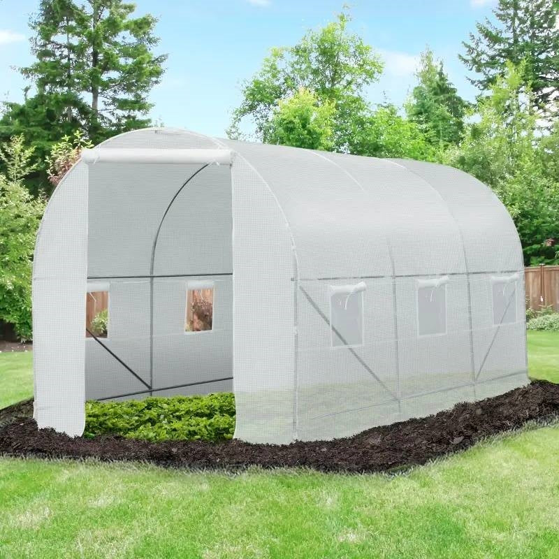 14.7 Ft x 6.5 Ft Outdoor Greenhouse w/ Heavy Duty Steel Frame and White PE Cover in garden setting