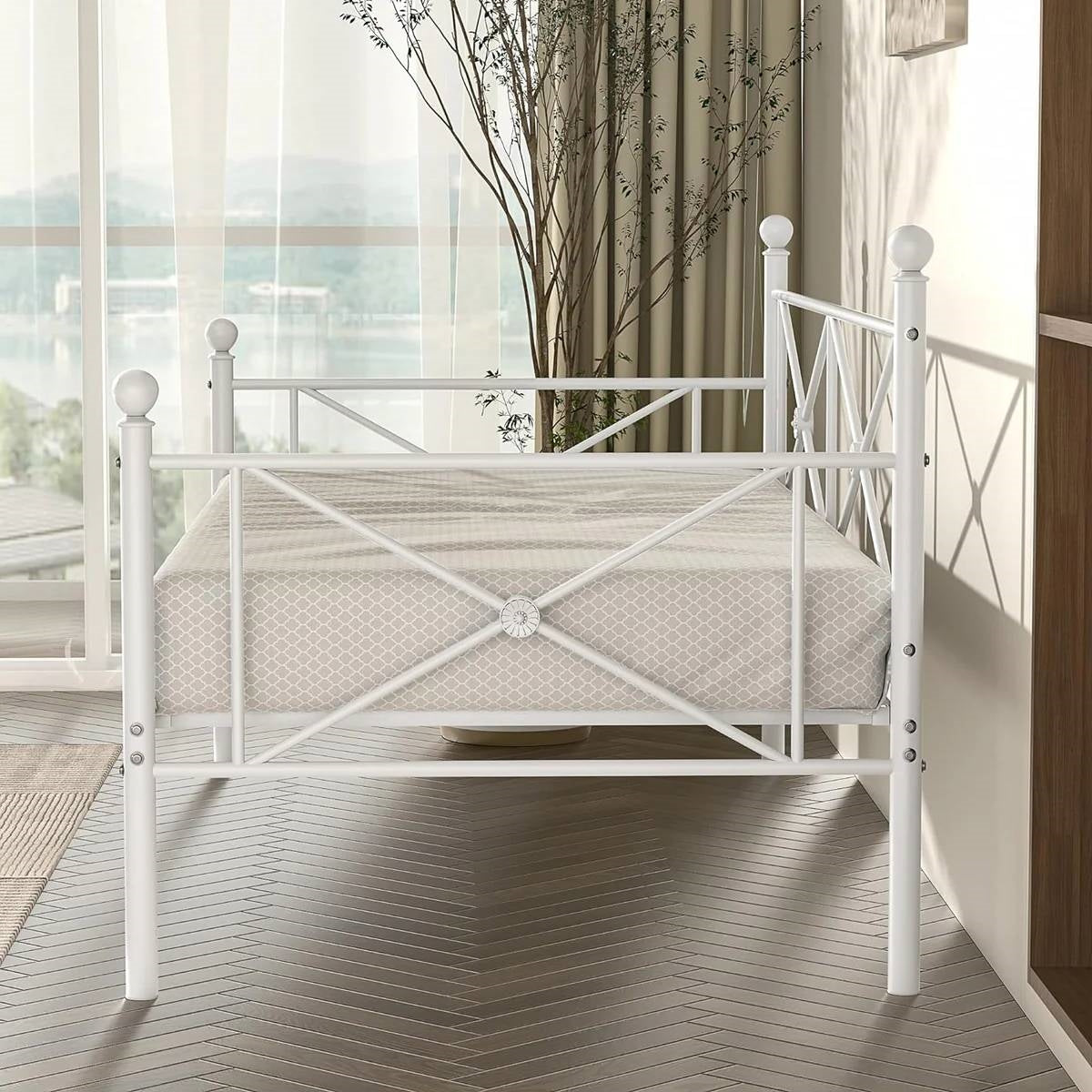Twin size Heavy Duty Metal Daybed Frame in Classic White Finish in a stylish bedroom setting.