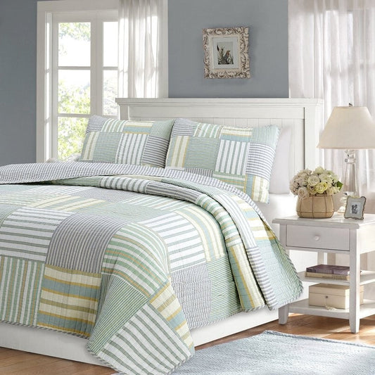 King Size Soft Reversible Patches 100% Cotton Quilt Set with striped patchwork in green, yellow, and blue shades on a bed.