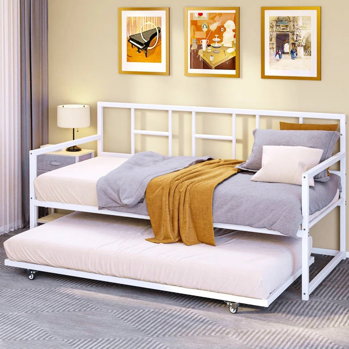 Twin size White Metal Daybed Frame with Roll Out Trundle Bed Frame in a modern living room setting.