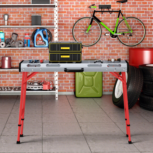 42 Inches x 21 Inches Welding Table with Adjustable Height and 2 Bar Clamps-Silver in a garage setup with tools and accessories