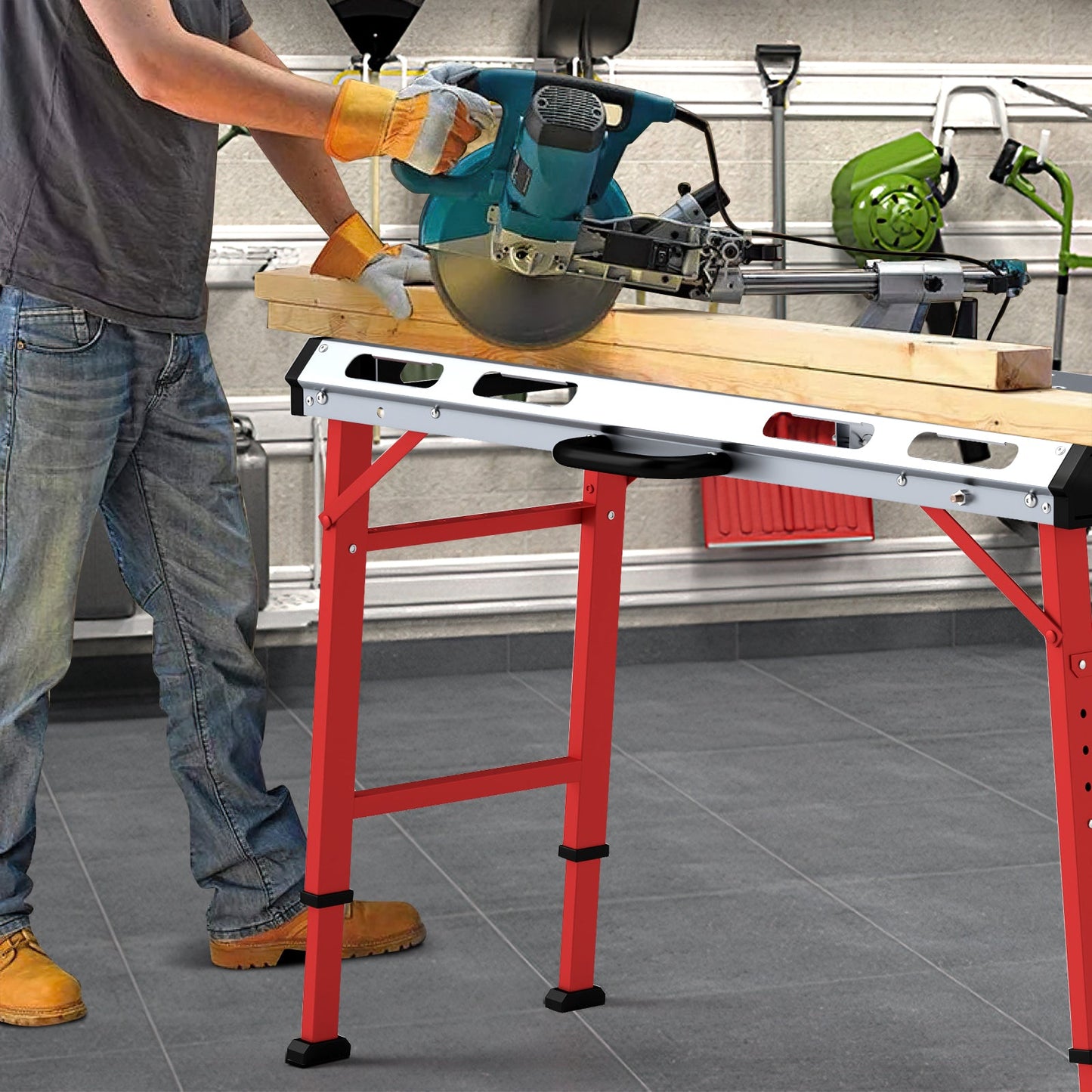 Person using a saw on a red adjustable height table in a workshop