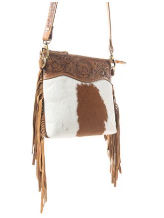 Western Meadows Brown Hair-on Cowhide Crossbody Bag with fringe and tooled leather trim.