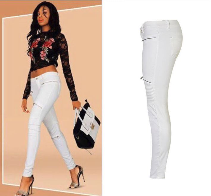 Model wearing 'Lola' White Faux Leather Zippered Knee Pencil Pants with side view detailing.
