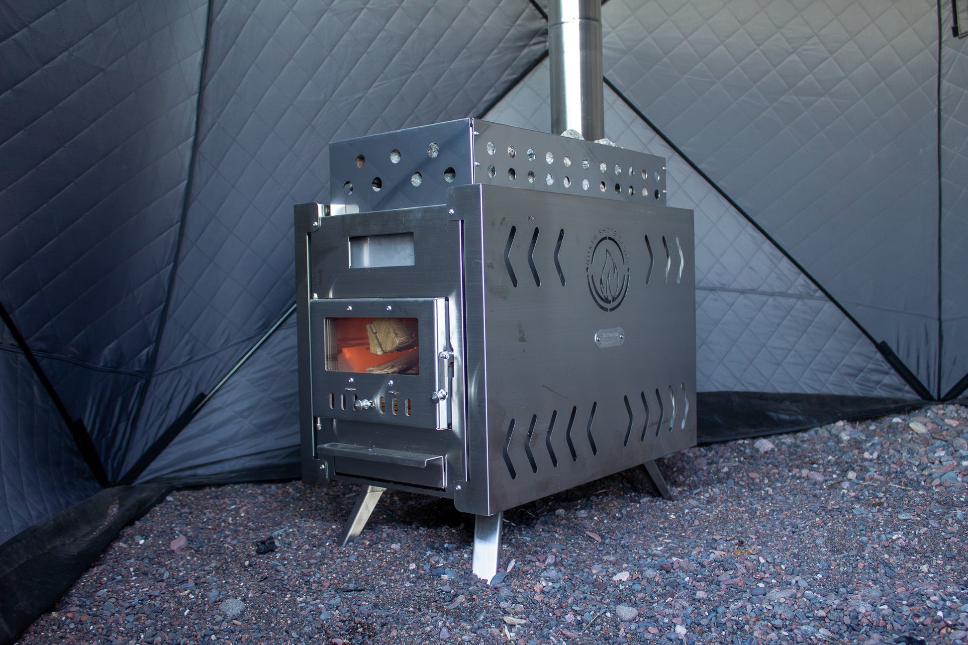 Wood burning stove inside Nova 6 Sauna Tent Starter Package (6-person) for backyard saunas